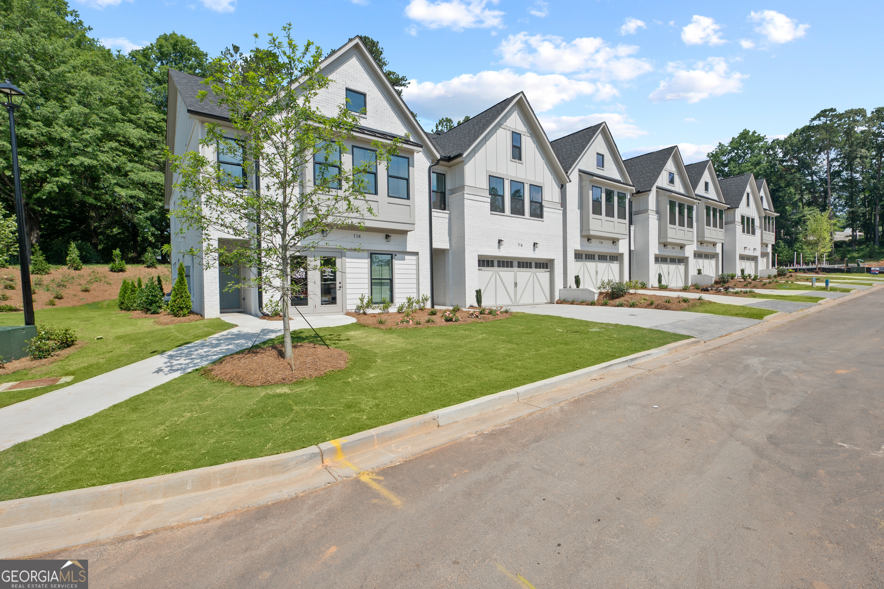 New Construction in Johns Creek! Devine townhome community featuring a small, exclusive cluster of only 31 units. This unit comes equipped with designer finishes including wide planked flooring, quartz countertops, gourmet kitchen with soft close cabinets and slide out drawers! Located inside Technology Park for quick access to all of your every day needs - great location! Minutes from St Marlo Golf Course, shopping, and more. Community offers its own fire pit, green space and pocket park in addition to nearby trails and shopping. Open and highly functional floor plan - The Cooper plan offers a large gathering room providing ample entertaining space to sprawl out with guests while utilizing the kitchen and eating spaces. Upstairs additional loft space can be used for an office, playroom, additional entertaining, or anything else you may need in addition to the 3 private bedrooms. Owner's Suite showcases a large walk in closet and a spa-like tile shower with sitting bench. Separate vanities for ideal separation and ease of use while getting ready. Laundry room conveniently located upstairs. Unit features a covered patio addition for private outdoor usable space as well. Quick Move In Opportunity! Ready September