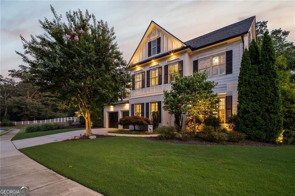 Absolutely stunning 5BR/4BA modern, light-filled home with over $150K in high-end upgrades and a sleek, contemporary design. The reimagined kitchen features marble countertops with a breakfast bar, custom ceiling-height cabinetry, and an eat-in area-open to a spacious living room that flows seamlessly to the professionally landscaped backyard. Featuring one of the best yards in the neighborhood, with professional landscaping, custom lighting (front and back), a terraced stone wall, flagstone walkways, a fully fenced lawn with irrigation system, and a large covered patio-perfect for outdoor entertaining. Inside, designer finishes include wide-plank French oak flooring, plantation shutters, a limewashed stone gas fireplace, and wrought iron stair railings. The main level also offers a formal dining room, a flexible living room/office space, and a guest bedroom with a full bath. Upstairs, the oversized primary suite is a private retreat with a soaking tub, large frameless glass shower, double vanities, and dual walk-in closets. A large bonus room/den, two additional bedrooms, a guest bath, and a laundry room complete the second floor. The third-level bedroom suite features a private entrance, full bath, loft area, and endless flexibility-perfect for a guest suite, home office, media room, or playroom. Walkable to Lewis Park, Marietta High, Burrus Elementary , and the nearby Kroger shopping center, and just minutes from the charm and amenities of Marietta Square, the nature trails of Kennesaw Mountain, and major highways. Don't miss this rare opportunity to own a truly turn-key home in one of Marietta's most sought-after neighborhoods. Luxury, location, and lifestyle-all in one. Schedule your private showing before it's gone!