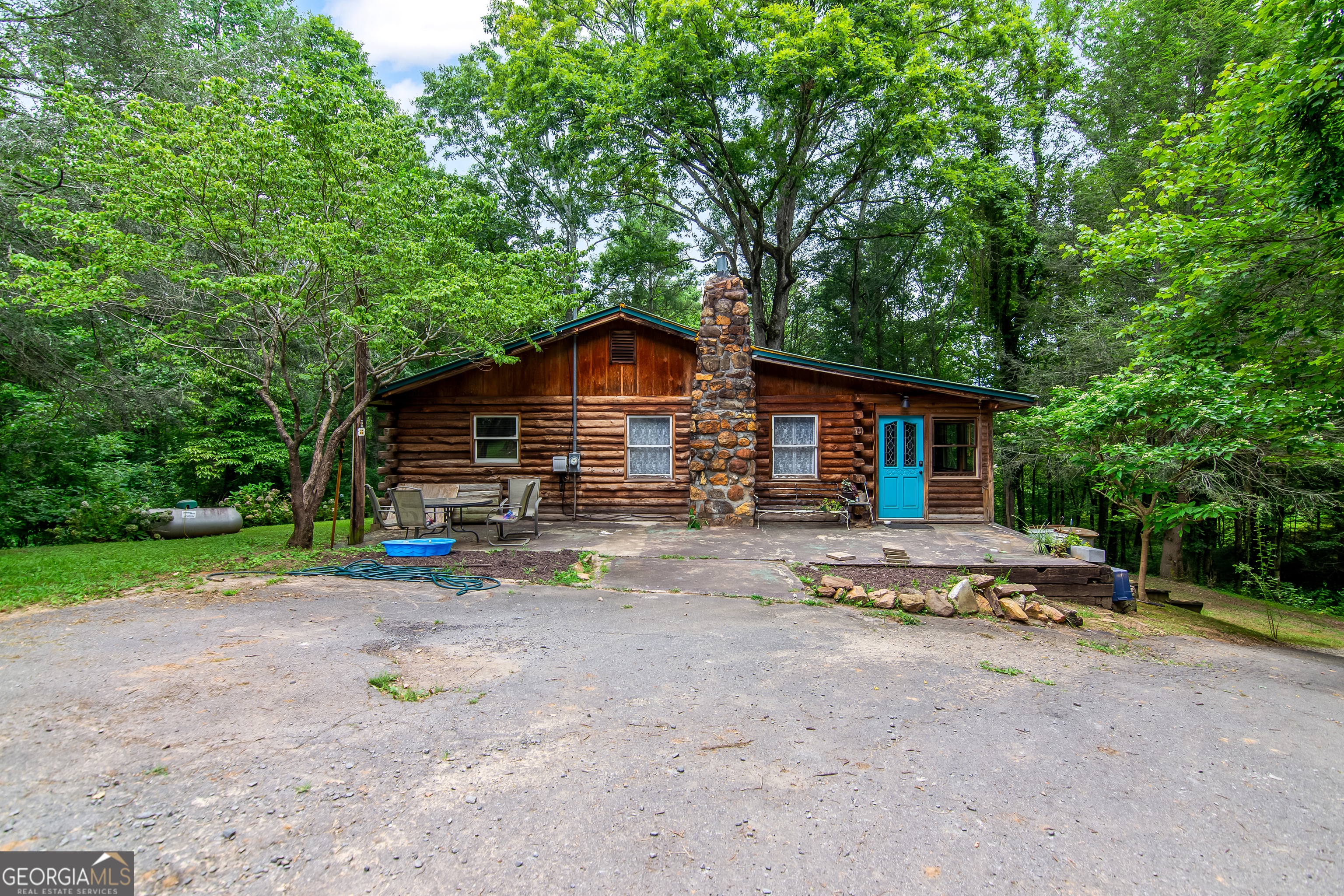 Huge Opportunity! 2 homes and more! This charming, rustic true log home is situated on 4+ acres of gently rolling land in the heart of Apple Country. The main dwelling includes 2 bed/1.5 bath with an unfinished basement at 1408 sq ft. This property also features a 2 bed/1 bath mobile home which is currently serving as a long term rental, providing immediate income. With No HOA and No Restrictions, you'll be free to create your ideal future. Aside from 2 homes already in place... there is another .5 Acre parcel included in the sale as well, which has an old condemned/burned home, septic, and power. Main dwelling has a popular duel-fuel heating system and large storage shed. All these features truly set this property apart and offer a rewarding financial opportunity. All this and more, less than 5 minutes from town. Come check it out!