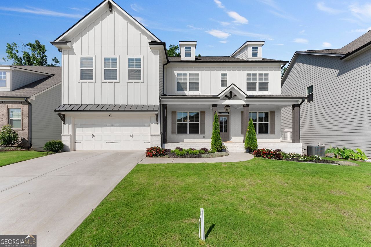 MOVE-IN READY 5BR/4BA home in sought-after Mundy Mill! This spacious 3,540 sqft home features an oversized primary suite with a custom California closet and spa-style bath with double walk-in shower, dual vanities, and bench seating. The gourmet kitchen includes granite countertops, double ovens, walk-in pantry, and upgraded luxury fixtures. Enjoy formal and casual dining spaces, plus an upstairs loft with double doors perfect for a home office or media room. Covered back porch with swing, custom mudroom, walk-in closets, and unfinished basement for storage. Washer, dryer, refrigerator, TVs included. OWNER/AGENT.