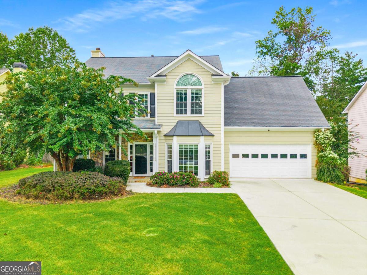 This 4-bedroom, 2.5-bath home boasts timeless style with modern convenience, perfectly positioned in one of Alpharetta's most desirable communities. From the moment you enter, you're greeted by a gracious formal dining room and formal living room, perfect for hosting memorable gatherings or creating a quiet retreat. The heart of the home is the open-concept family room and kitchen, anchored by a stunning stacked-stone fireplace and framed by a wall of windows that flood the space with natural light. The kitchen is designed to inspire your culinary masterpieces and cooking conversations, featuring stainless steel appliances, dual-oven gas range, generous prep and storage space, and a refrigerator with a unique flex door that adapts to your needs. The bar seating is perfect for casual bites, while the sunny bay-window breakfast nook invites you to linger over coffee with serene backyard views. Upstairs, the owner's suite is a private sanctuary with a tray ceiling, spacious sitting area, and a spa-like en suite bath complete with dual vanities, a soaking tub, and a glass-enclosed shower. Three additional bedrooms provide flexibility for family, guests, or work-from-home needs. Step outside to enjoy a private patio, perfect for outdoor dining, quiet evenings under the stars, or weekend barbecues. A backyard shed adds practical storage for gardening or outdoor equipment. The community offers all the things you've been looking for including a pool, tennis courts, and a playground- endless opportunities for recreation and connection. Families will appreciate being in the highly sought-after Chattahoochee High School district, with Webb Bridge Park, local shops, dining, and everyday conveniences only minutes away. Some photos have been virtually staged.