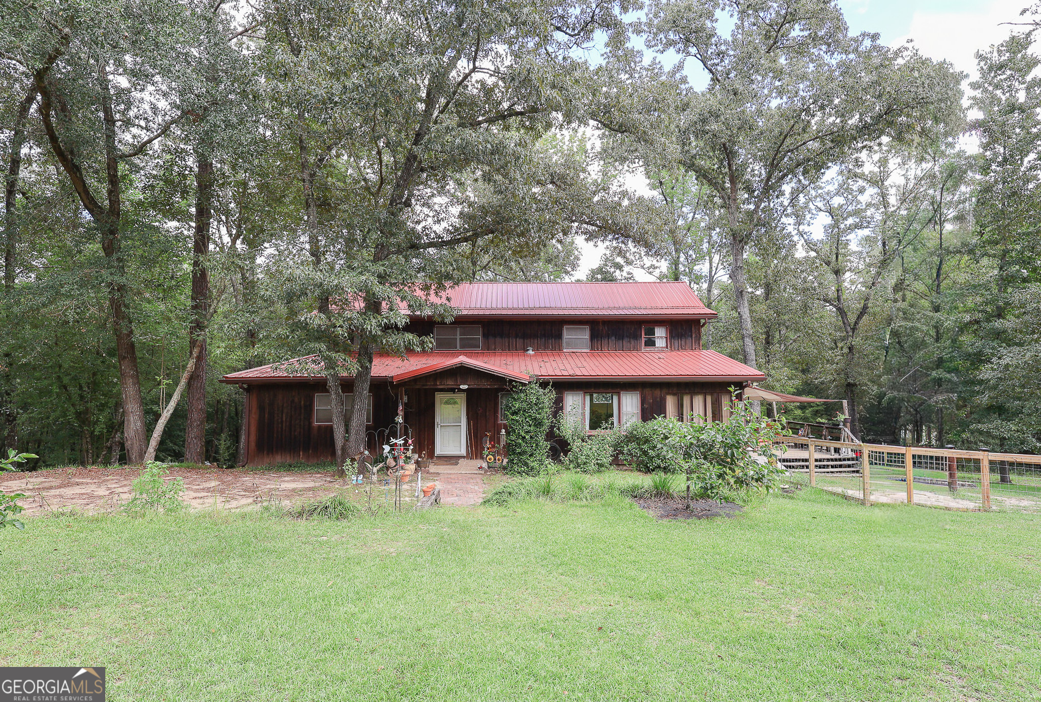 Welcome to 299 Chapman Road, a private retreat tucked away on 28.85 acres in Crawford County! This 4-bedroom, 3-bath home features a charming cabin-style exterior and a long, private driveway leading to peace and seclusion. Inside, enjoy a spacious layout with a sunroom off the kitchen, new wall ovens, and a separate dining room for family meals and gatherings. Major updates include new HVAC systems and a roof that's less than 2 years old, giving you comfort and confidence for years to come. Step outside to a side patio with a fenced area, perfect for pets or outdoor entertaining. A barn/workshop on the property provides endless options for storage, hobbies, or animals. With room to roam and modern updates already in place, this property is ready to welcome you home!