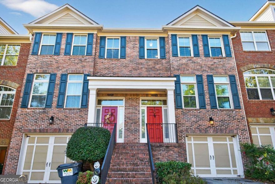 Welcome to this charming and well-maintained 3-bedroom, 2.5-bath townhome in the highly sought-after gated community of Abberley Township. This home offers a perfect blend of comfort, style, and convenience in one of Johns Creek's premier locations. Step inside to find lovely hardwood floors, crown molding, and abundant natural light throughout the main level. The open-concept layout provides a seamless flow between the living, dining, and kitchen areas - ideal for both everyday living and entertaining. You will also find plentiful storage in the garage as well as in the various closets throughout the home. Upstairs, the spacious primary suite features a tray ceiling, walk-in closet, and private bath. Each additional bedroom has its own en-suite bathroom, including a large lower-level suite with its own patio, perfect for guests or a private home office. Enjoy outdoor living on the newly redone composite deck, surrounded by mature trees for added privacy. Recent upgrades include a new roof, HVAC, water heater, and several triple-pane windows for improved energy efficiency. The community offers swim and tennis amenities, well-kept grounds, and convenient guest parking directly across from the home. Located just minutes from top-rated schools, shopping, dining, and major highways - schedule your tour today!