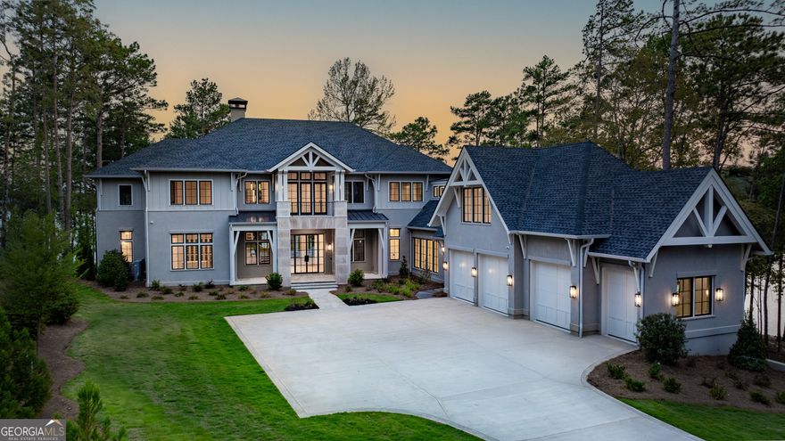 WELCOME TO THE PINNACLE OF LAKESIDE LUXURY, NESTLED WITHIN THE PRESTIGIOUS ENCLAVE OF RICHLAND POINTE AT REYNOLDS LAKE OCONEE. This brand-new custom masterpiece redefines luxury living with its breathtaking design and exquisite attention to detail. This property offers an extraordinary lifestyle, where every element exudes elegance and grandeur. Spanning an impressive 9,818sf of heated living space, this home provides a seamless blend of contemporary style and timeless charm. The wide-plank European oak wood floors and solid oak beams accentuate the grandness, while the quartz and natural stone countertops add a touch of refined sophistication. The marble and Thasos shower walls and marble floors in the bathrooms elevate the aesthetic to unparalleled heights. Featuring six ensuite bedrooms and eight full bathrooms, with an additional two half bathrooms, this home ensures comfort and privacy for all. A flex room above the garage with a full bath offers an array of versatile living options as a teen suite, bunk room, home gym or studio. The thoughtfully designed main level hosts expansive lounge and dining areas, gourmet kitchen featuring custom cabinetry, top quality appliances and scullery. Adjacent you will find an office, elevator and your wet bar and wine/bourbon room, featuring a Sub-Zero wine tower. Three laundry quarters are available: one in the primary suite, one on the main level, and one on the second floor. Here you will find an elevated space with wet bar that is enhanced with coffered ceilings, custom built ins, floor to ceiling windows and doors opening to a balcony that provides breathtaking pool and lakeside views, while the terrace level space is pre-wired for a potential movie room, offering an immersive home theater experience. Set on a sought-after point-lot with 480' of shore & over 240 of water-view, each room in this home offers expansive vistas of the serene Lake Oconee. The three-level terraced infinity pool, spa and natural stone sun decks create a sanctuary of leisure and tranquility. This extraordinary residence is not just a home; it is a statement of luxury and a testament to the art of fine living. Discover the epitome of elegance at Reynolds Lake Oconee, where every moment is a masterpiece, and every view is a canvas of perfection. Schedule your private tour today and step into a world of unparalleled luxury. Seller is making a Club Membership available to enjoy all that this exceptional community has to offer its residents.