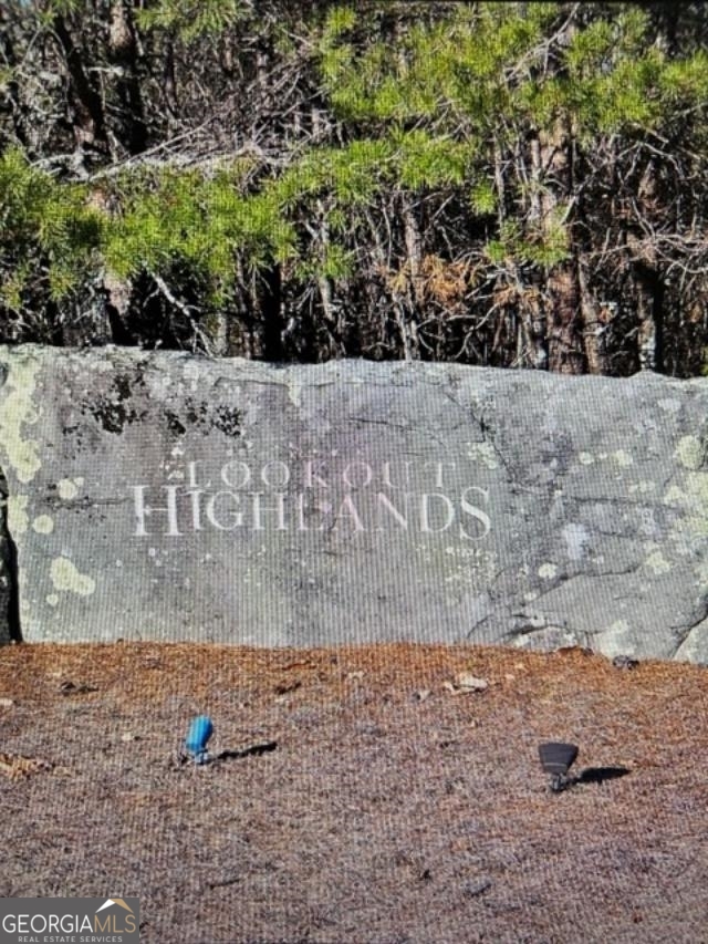Beautiful 6.9 Level Acres of serenity and beauty in Lookout Highlands, a 1500 Acre Gated Community atop Lookout Mountain. A community of 175 estate size residential lots offering quiet lakes, hiking trails, water falls, and located one mile from the award winning McLemore Golf Resort and the new Hilton Curio Collection Hotel, Lookout Highlands has it all. This 6.9 acre corner lot has been soil tested and is ready to be built on and called home by someone seeking a lifestyle 2nd to none. With it's proximity of 2 hours from Atlanta, Nashville, and Birmingham, and 35 minutes to Chattanooga, you'll find a lifestyle of serenity while still convenient to major cities and attractions. With underground Utilities, public water, and Fiber Optic Service with speeds up to 1 gig, you can enjoy the convenience of working remotely while enjoying beautiful mountain scenery and breathing the crisp Lookout Mountain air. Less than a mile away, you can enjoy award winning golf at McLemore's Highlands Course and The Keep, and play cliff-edge holes developed by Bill Bergin and Rees Jones. Just minutes away, you'll find plenty of dining options like The Canyon Grill, The Creag at McLemore, Lookout Mtn Pizza Company, and Cafe 136 and more. With over 600 acres of common property to include stocked lakes, hiking trails, and waterfalls, Lookout Highlands is committed to preserving the natural beauty of the community with minimum impact to the environment to promote and protect the value of the property. The HOA fee is $1,000 yearly and is well managed.