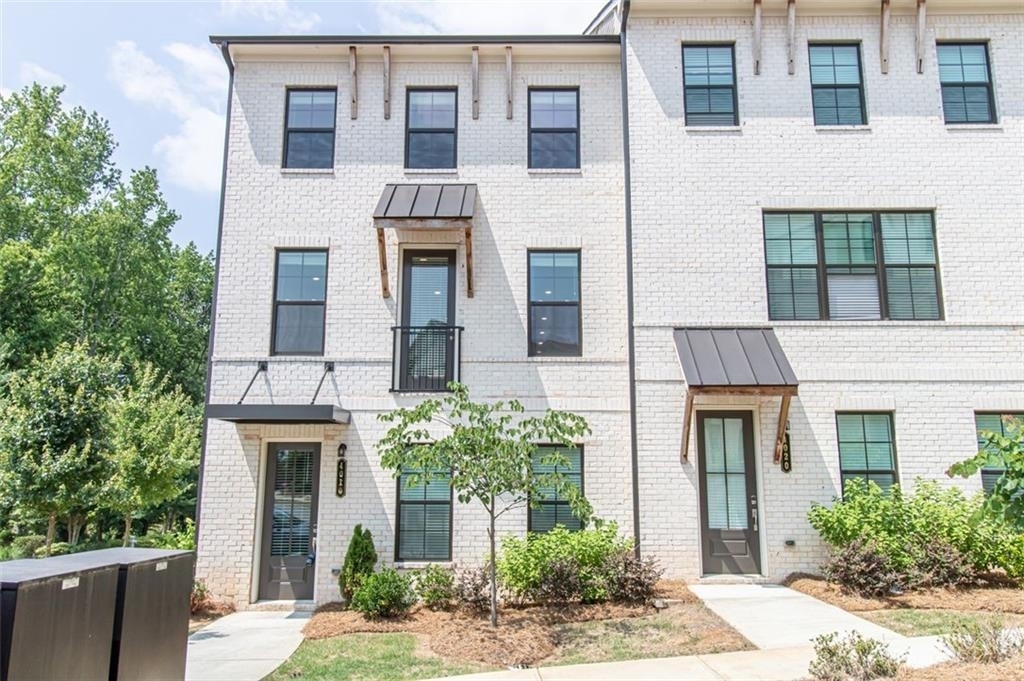 This beautiful 3 story brick townhome has 4 bedrooms and 3.5 bathrooms and is luxurious! The gourmet kitchen has an oversized island, tons of cabinet space, Quartz countertops, stainless steel appliances and so much more! The family room has a state of the art 55" electric fireplace with a tile surround. The master bathroom features a double vanity, private toilet room and walk in shower. All the secondary bedrooms are spacious and have 9' ceilings! The property is located in the Heart of Roswell! Close to the highway, shopping, restaurants, etc. This one will not last long!