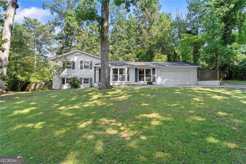 Welcome to this beautifully updated 4-bedroom, 2-bath tri-level home located on a quiet, tree-lined street just minutes from vibrant downtown Smyrna. This move-in ready residence boasts a brand-new roof, freshly painted exterior, and modern updates throughout. Step inside to find spacious living areas filled with natural light, complemented by stylishly updated bathrooms and well-appointed finishes. The functional tri-level layout offers flexibility and privacy, perfect for today's lifestyle. Outside, enjoy a generous backyard space ideal for relaxing or entertaining. The attached 2-car garage provides ample storage and parking. Situated in a peaceful neighborhood, this home offers the perfect blend of comfort, convenience, and charm-just a short drive to shopping, dining, and local parks. Don't miss your opportunity to own this thoughtfully renovated home in one of Smyrna's most desirable locations!