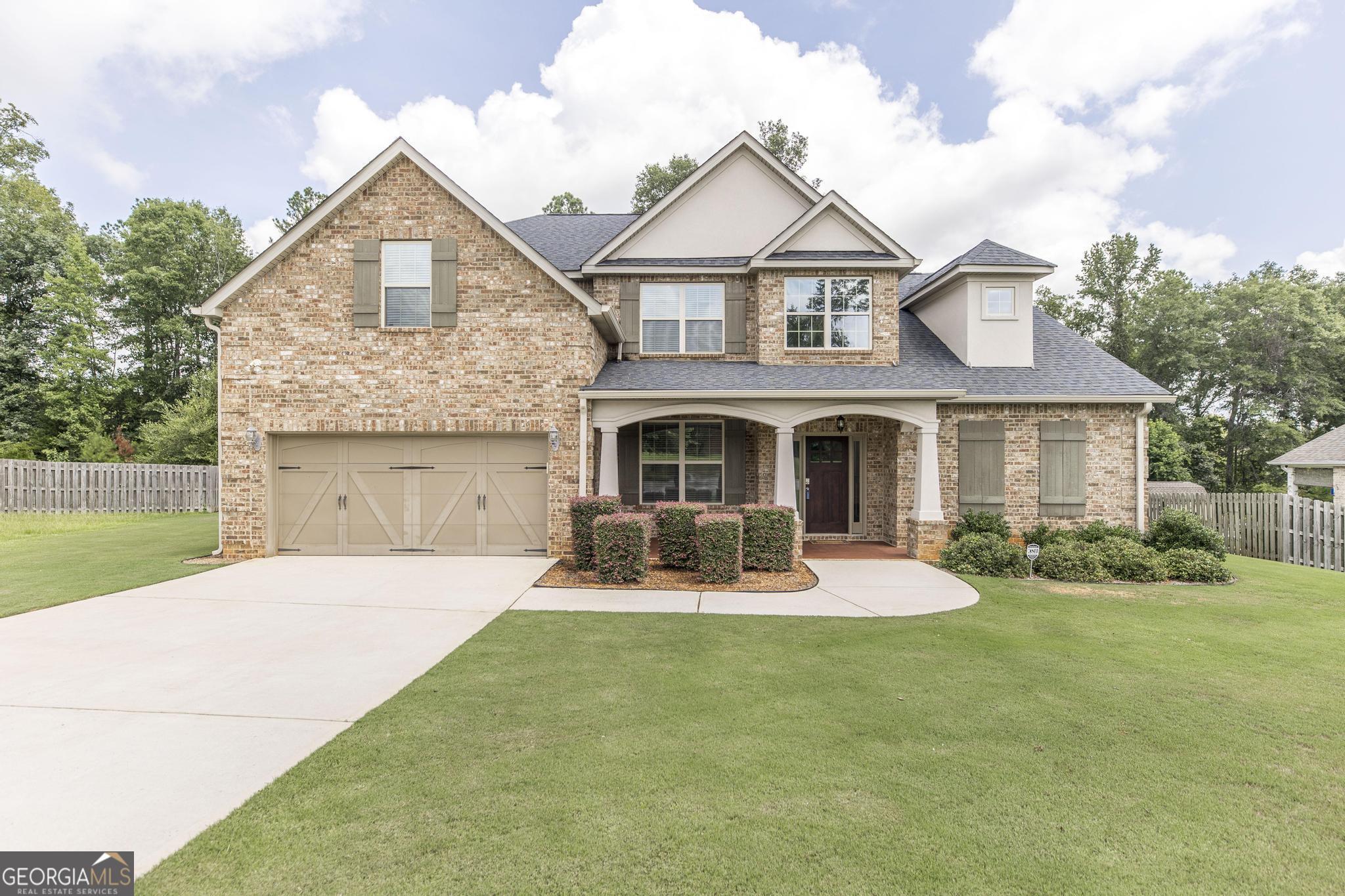 5BR/3.5BA All Brick home in Morgan Ranch, this is one you will want to see, with its amazing floorplan that features large rooms, 2 living areas, and a formal dining room. The kitchen and living room are very spacious and include a double sided fireplace to give you that cozy feeling. The kitchen features a massive granite island that you will enjoy gathering around. The large master suite is on the main floor with a large master bath with double vanities and separate showers. The upstairs features 4 BR / 2BA with one bath being jack n jill. There is an additional living space that can be used for extra living room, game room, or media room. This floor plan has so much to offer. The home also features the very desirable game day porch. If space and beauty is what you are looking for this is the one.