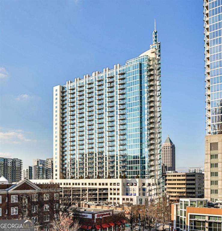 Perched high above the heart of Midtown Atlanta, Unit 2705 at 860 Peachtree Street offers breathtaking panoramic views and upscale city living at its finest. This 2-bedroom, 2-bath residence in the sought-after Spire building features floor-to-ceiling windows, a modern open layout, and sleek finishes throughout. Enjoy resort-style amenities including a 24-hour concierge, state-of-the-art fitness center, pool, clubroom, and secure parking. Unit also includes a storage unit. Just blocks from MARTA Midtown, Publix, Starbucks, the Fox Theatre, and Piedmont Park-with dozens of Atlanta's top restaurants and cafes steps from your front door. Whether you're entertaining or relaxing above the city, this is elevated living in every sense.