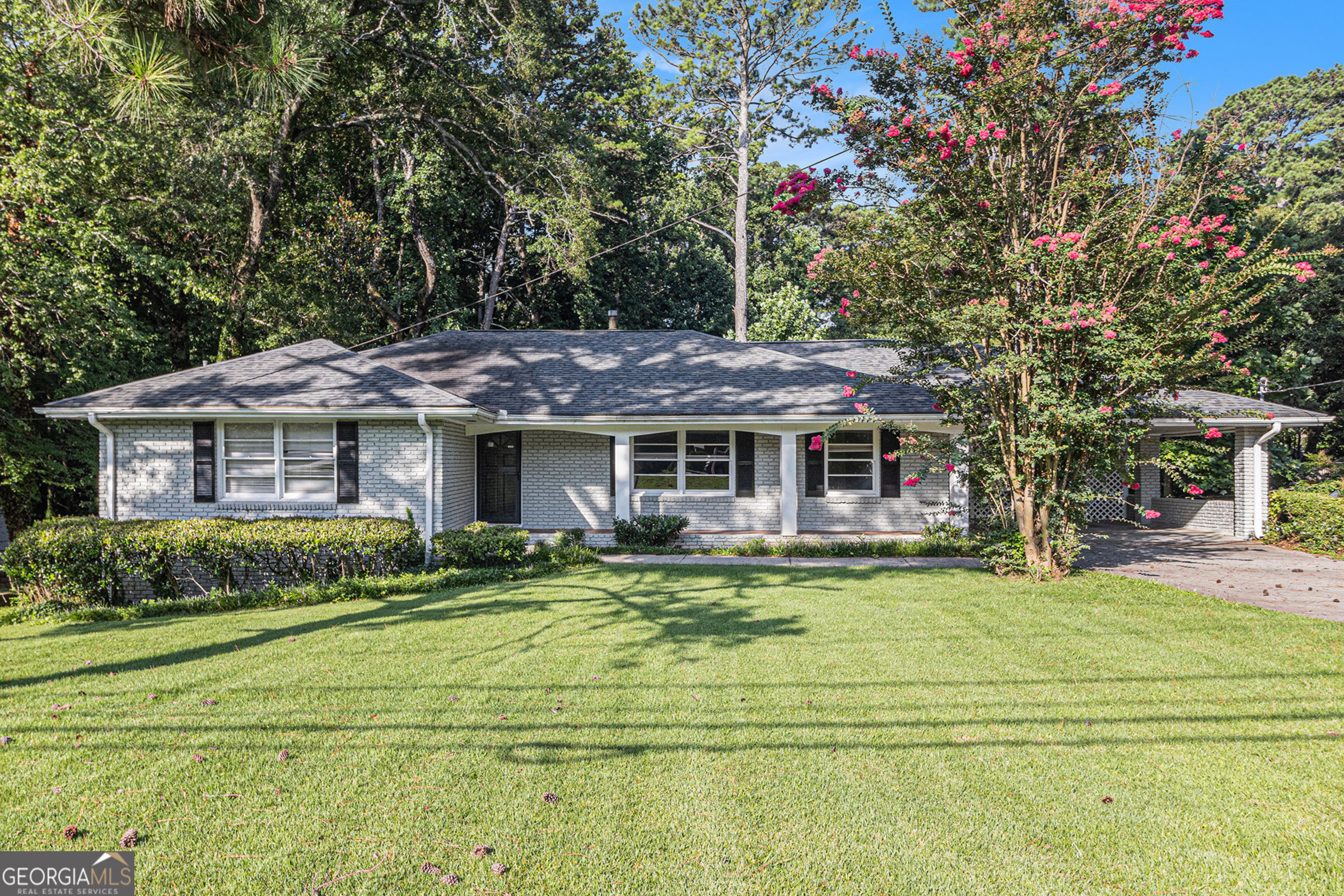 Live in the heart of it all! Ideally located on Shallowford between I-85 and Briarcliff, this renovated ranch puts you just minutes from Brookhaven, the CDC, Emory, Mercer, and I-285-an unbeatable Atlanta location! Step inside to find a beautifully updated open kitchen featuring solid surface countertops, stainless steel appliances, and a stylish tile backsplash. Dark walnut hardwood floors flow seamlessly throughout, complemented by ceramic tile and modern grey-and-white tiled bathrooms. Downstairs, you'll discover a private finished office space-perfect for remote work-plus a spacious unfinished area ideal for storage or future expansion. Outside, enjoy an oversized, park-like backyard that's perfect for BBQs, entertaining, or simply relaxing. This home truly offers the best of location, style, and functionality. Don't miss your chance to make it yours!