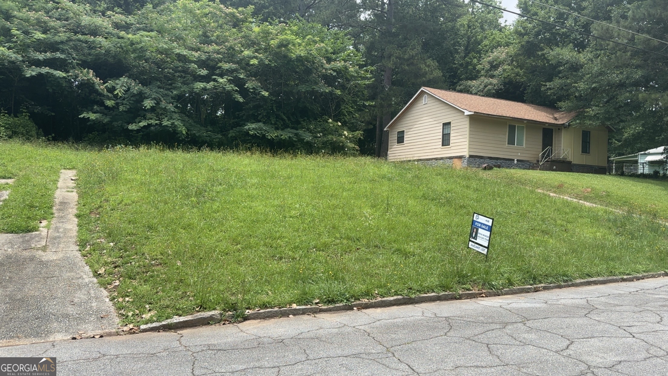 Fantastic opportunity to own residential lot in the established Ivydale neighborhood of East Point! This spacious, level lot offers the perfect setting to build a custom home or pursue an investment project in a growing area of South Fulton. Located just minutes from downtown Atlanta, Hartsfield-Jackson Airport, and Tyler Perry Studios, this property combines convenience and potential. All utilities-water, sewer, gas, and electric-are available. No HOA and zoned for single-family use. Enjoy proximity to parks, public transportation, shopping, and schools. Whether you're a builder, developer, or future homeowner, this is a must-see lot with room to grow!