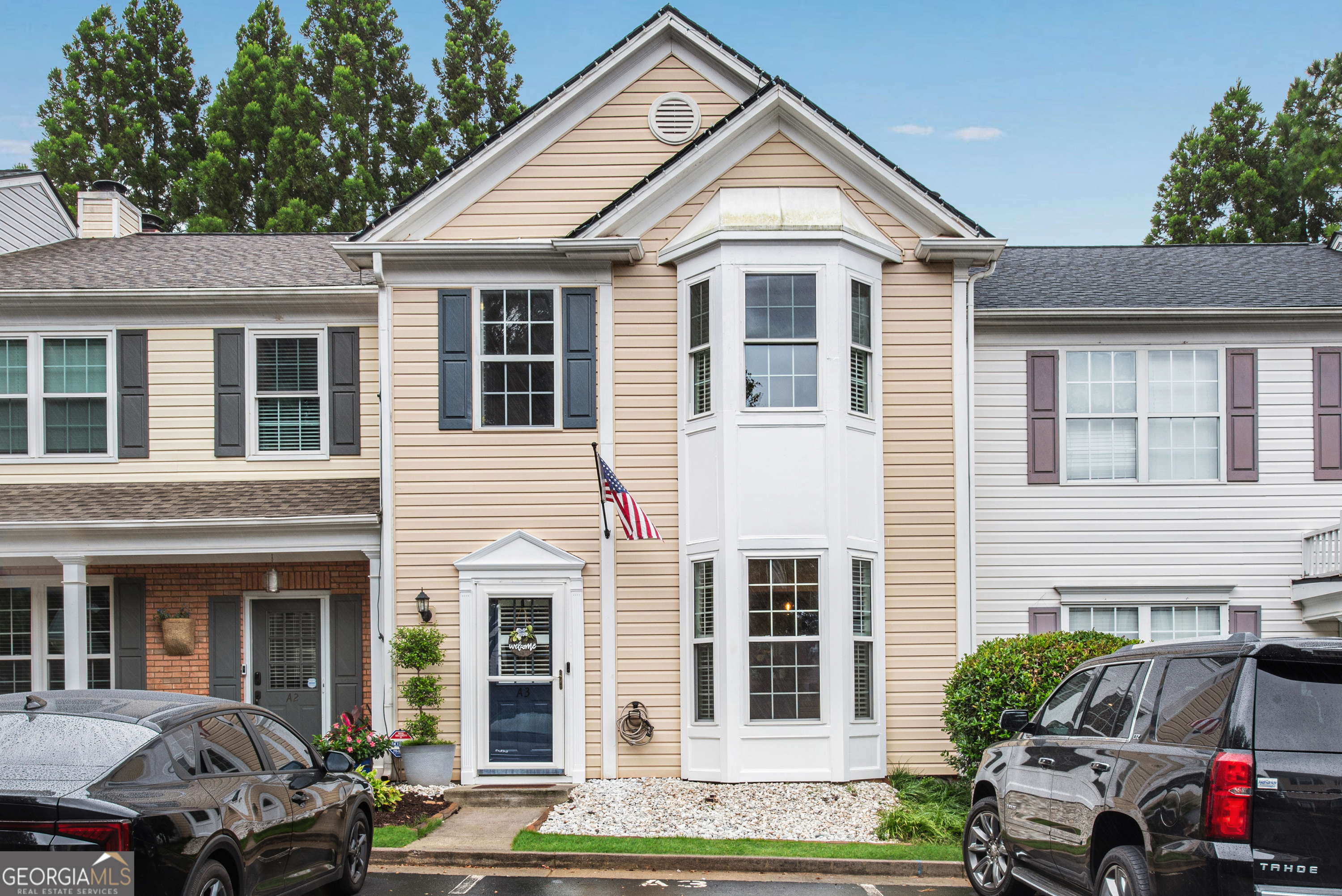 This beautifully maintained 2-bedroom, 2.5-bath townhome is perfectly situated in the heart of Alpharetta just 2 miles from Avalon, minutes to North Point Mall and downtown Alpharetta, and with quick access to GA-400 for easy commuting. Inside, you'll love the open floor plan featuring rich luxury vinyl flooring on the main level, fresh interior paint, and elegant plantation shutters throughout. The spacious family room is anchored by a striking stone fireplace and opens to a fully updated kitchen with granite countertops, stainless steel appliances, tile backsplash, and extensive molding details. A stylishly renovated half-bath on the main level is perfect for guests. Upstairs, you'll find two large bedrooms, each with its own updated en-suite bathroom. The primary bedroom features smart lighting compatible with Alexa for added convenience. Bay windows on both levels fill the home with natural light, while a beautiful wrought iron bannister adds a sophisticated touch. Step outside to your private backyard retreat, complete with a wood privacy fence, glass/screen storm door, and artificial turf for year-round, low-maintenance beauty. Additional upgrades include a newer roof (approximately 5 years old), new windows, water filtration system and a brand-new HVAC system, giving you peace of mind and energy efficiency. The neighborhood also offers a sparkling community pool for relaxation and recreation. Move-in ready and loaded with thoughtful updates, this townhome offers the perfect blend of comfort, style, and unbeatable location. (Pictures will be uploaded on Wednesday). Home is a "10".