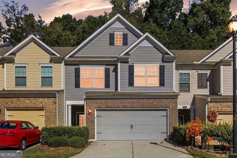 Welcome to this well-maintained 3 bedroom, 2.5 bathroom townhome located in a sought-after community in Cumming. Built in 2015, this home features an open-concept main level with hardwood flooring and a spacious family room that flows into the dining area and kitchen. The kitchen offers solid-surface countertops, stainless steel appliances, ample cabinet storage, and a convenient breakfast bar.     Upstairs, the large primary suite includes a walk-in closet and an ensuite bath with dual vanities, separate tub and shower. Two additional secondary bedrooms share a full hall bath, and the laundry room is located conveniently on the upper level.  The upstairs loft would make a great teen hangout, playroom or office space!  A private rear patio provides space for outdoor relaxation, and the two-car garage offers secure parking and extra storage.    The community features a swimming pool, tennis courts, playground and basketball court. Conveniently located near GA-400, shopping, dining, and across the street from the aquatic center!    This property offers low-maintenance living in an excellent Forsyth County location.  Schedule your showing today to view this freshly painted move in ready home-Seller is offering a $2000 carpet allowance for buyer to take advantage of before closing!