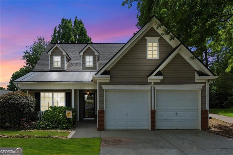 Location, Location! Less than 15 minutes from downtown Woodstock and I-575, this charming 3-bedroom, 2.5-bathroom home offers the perfect blend of comfort and convenience. Featuring a sought-after primary suite on the main level, everything you need is within easy reach. As you step past the cozy front porch, you're welcomed by a two-story foyer with a versatile bonus room to your left. Moving further into the home, you'll find a half bathroom, laundry closet, and primary bedroom for added convenience. The spacious family room sits directly ahead, while the kitchen-easily accessible from both the garage and front entrance-is located to your right. Tucked neatly behind the kitchen is a staircase leading to the second floor, where you'll find two additional bedrooms and a full bathroom. Step out into the backyard, and you'll enjoy a fenced backyard and a full view of the community pool parking lot, which also serves as the pickup and drop-off point for elementary, middle, and high school buses. To the right, you have direct access to the tennis courts. A short walk further takes you past the park and through a scenic pasture leading to Green trails, complete with a charming bridge and creek. Located in the highly desirable Village at Weatherstone, this home offers not only great community amenities but also unmatched proximity to shopping, dining, and recreational activities in the heart of Woodstock.