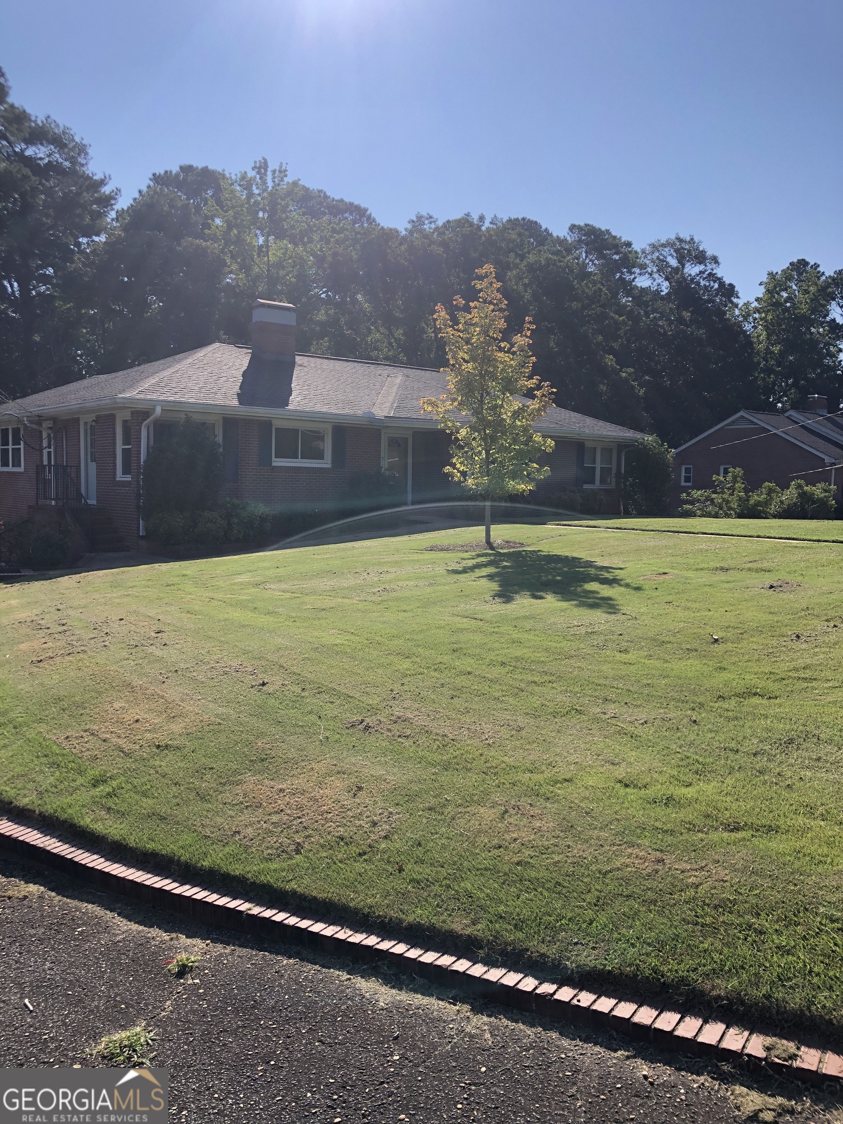 Wonderful large home in the heart of Valley, Al. Great neighborhood with large yards. This home offers 4 bedrooms with 2 and 1/2 baths. The foyer, kitchen, breakfast area, dining room, living room, sunroom, an office area/ formal sitting area, two bedrooms and one and a half baths are on the first floor. Downstairs (basement) offers two bedrooms, 1 bathroom, single car garage with storage room and workshop area. There is an additional room downstairs great for a kids playroom, craft room, large office or an additional bedroom. Laundry room can be upstairs or downstairs. Off the main floor is a large deck that overlooks the fenced in rear yard. The location of this home is convenient to any and all amenities in the area. This home has plenty of closet and storage space and character. Enjoy the sunroom off of the Dining room or relax on the large deck. Total of nearly 3000 square feet of heated/ cooled space plus the basement garage/ workshop. This is a must see and appreciate. Move in ready.