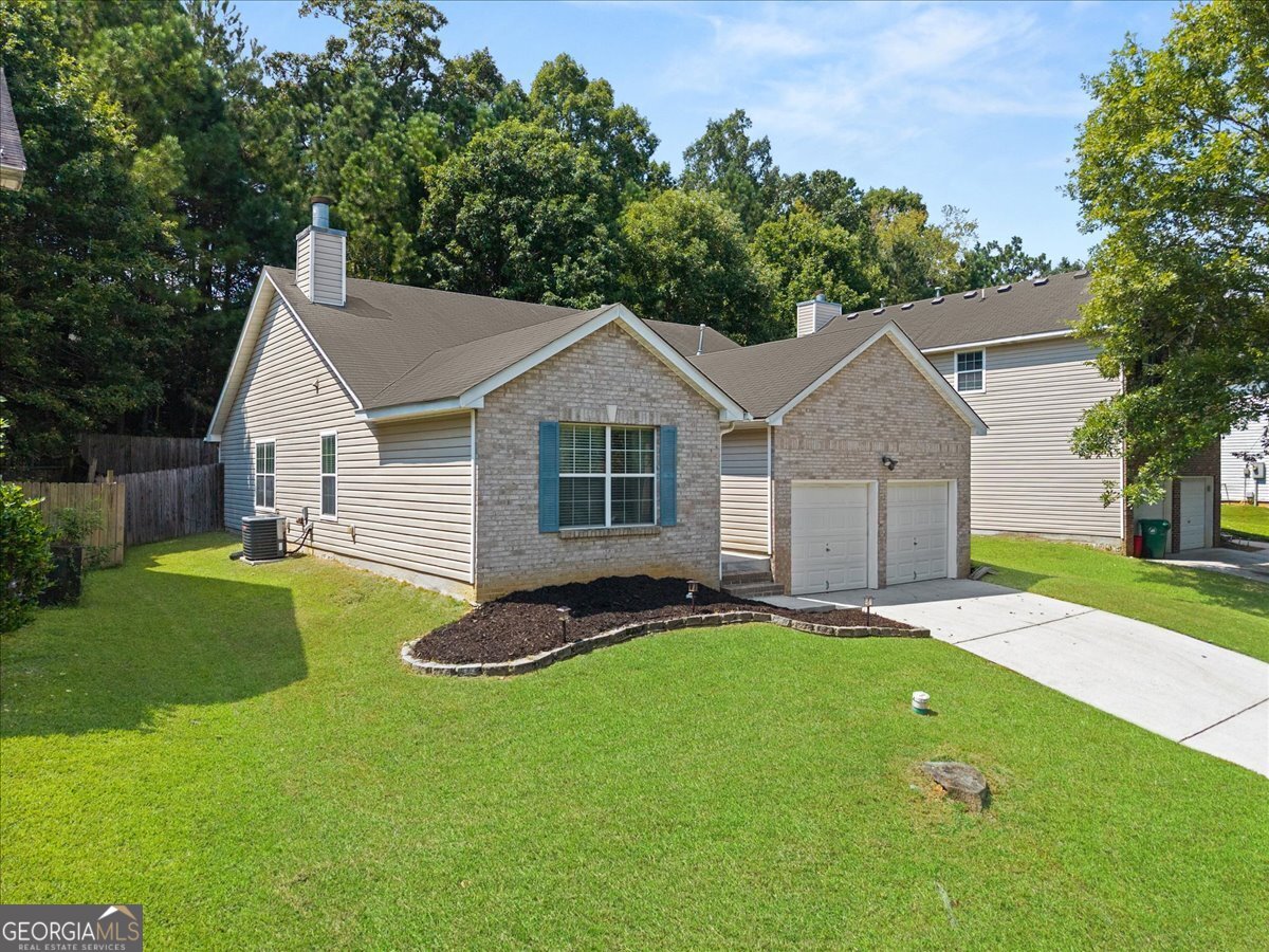 Welcome Home to Comfort and Convenience in Ellenwood! Experience the perfect blend of suburban tranquility and urban accessibility as this property places you minutes away from highways all while being nestled in a quiet community. Step inside to discover a meticulously maintained interior that exudes comfort and functionality. The eat-in kitchen is spacious with an open layout, making meal preparation a delight. The open concept family/living room features a charming fireplace and access to the dining area, creating a cozy ambiance for gatherings and relaxation. The spacious bedrooms offer plenty of space for personalization and comfort. The generously sized owner's suite is a true haven, offering an en suite bathroom complete with a vanity, shower, and a luxurious garden tub - the perfect recipe for sweet relaxation after a long day. This property is a testament to pride in ownership, with every corner exuding care and attention. Don't let this opportunity slip through your fingers - come and experience the comfort, convenience, and warmth that this wonderful home offers.
