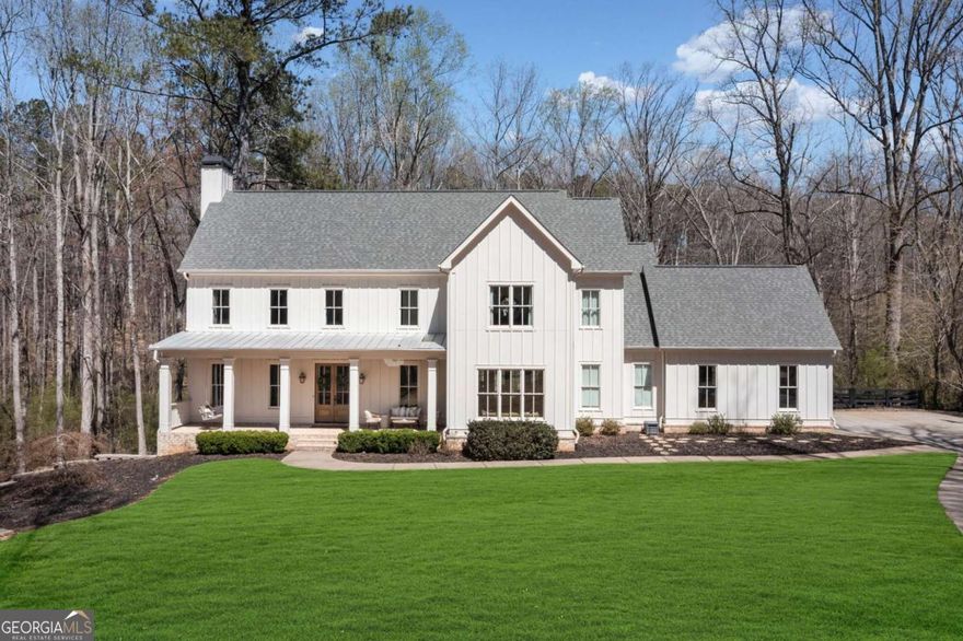 Tucked away on a private cul-de-sac lot in one of Alpharetta's most scenic equestrian enclaves, this beautiful designer appointed 6-bedroom, 5.5-bath estate offers the perfect blend of space, comfort, and quiet sophistication. The location is central to downtown Woodstock, Canton, Alpharetta, and Milton. High ceilings, natural light, and a seamless layout create an inviting flow throughout the home, ideal for both relaxed living and entertaining. At the center of it all is a chef's kitchen with a 48-inch professional range, custom cabinetry, premium appliances, and an oversized island that brings everyone together. The main-level primary suite is a peaceful retreat with views of the private backyard, a spa-like bath, and a large walk-in closet-designed for comfort, function, and easy one-level living. The finished terrace level adds versatility with two additional bedrooms, generous entertaining areas, and flexible space for a gym, media room, or wine cellar. Upstairs, a bonus room above the garage and a second living area offer even more space to relax, work, or play-all enhanced by the home's continued high ceilings and open feel. Outside, the expansive backyard provides endless possibilities for outdoor living-whether you envision a pool, garden, or simply the serenity of nature in your own private setting. A rare opportunity to enjoy graceful living in one of the areas most sought-after communities. An Alpharetta address with Cherokee county taxes, and in top rated school districts!