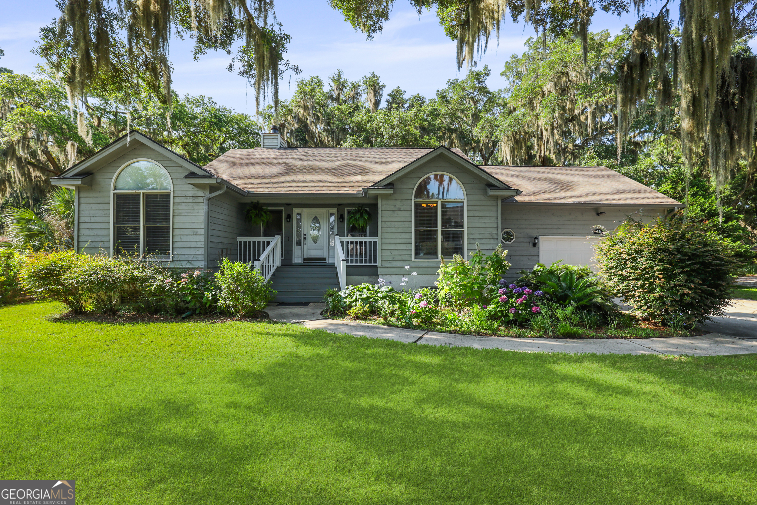 Welcome to your private retreat on almost an acre of beautifully landscaped grounds in Strathy Hall. This lovely 3-bedroom, 2-bathroom split plan home offers the perfect blend of comfort, charm, and outdoor living. Step inside to find a light-filled living room with vaulted ceilings and a sunroom with walls of windows that bring the outside in--perfect for relaxing or entertaining. The kitchen has tons of cabinet space and a breakfast nook that also leads to the bright and airy sunroom. Out front, enjoy the peaceful covered porch and serene views of the lush gardens. Outdoors, youll discover a sparkling built-in pool surrounded by vibrant hydrangeas, mature oaks, and a cozy swing within a fully fenced oversized yard. Enjoy views of the gardens from a spacious deck that expands the entire back of the home, ideal for summer gatherings or morning coffee. This property is truly a rare gem-an oasis offering space, beauty, and ease both inside and out. *Grass enhanced for photos