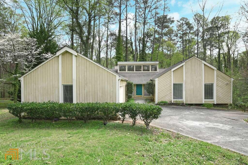 Welcome home to opportunity! This amazing, spacious ranch has a full, finished basement! Enjoy the peaceful , serene backyard and savor your morning coffee just off of the kitchen on the private grilling deck. 4 light, bright , roomy bedrooms on the main level. Updated secondary bathrooms. The primary bedroom is large and has a lovely sitting area that overlooks the nature filled backyard. The laundry room is conveniently situated on the main level and provides tremendous storage and additional pantry space. The formal dining room can easily accommodate large holiday gatherings and is open to the great room. Your house plants will thrive here as the large windows that adorn the back of the house allow sunlight to stream into the room. The full, finished terrace level has gorgeous polished concrete floors, a spacious "living room" area and 2 bedrooms. The full bathroom on the terrace level has been recently updated. In addition , there is unfinished space for a workshop or extra storage. Situated in desirable, close-in King's Cove. Enjoy a canoe or row boat ride on one of the lakes in this fabulous East Cobb swim/tennis neighborhood! Minutes to shops, restaurants and entertainment. Near the interstates for easy commuting into town. East Cobb award winning schools of excellence. This wonderful home is ready for your tender loving care and finishing touches so it will shine bright like a diamond!