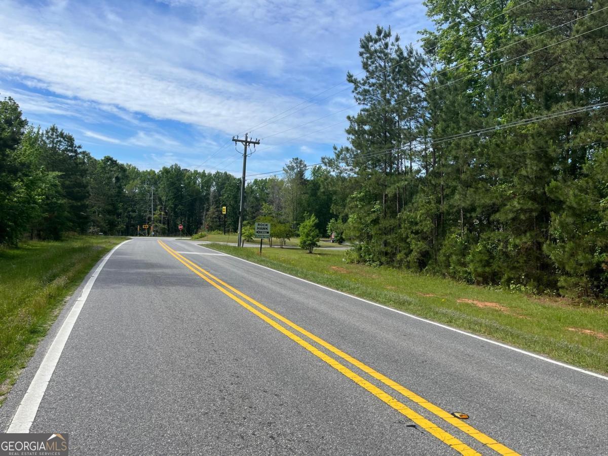 Build Your Business Between the Lakes!! Great Location, High Traffic, and Unlimited Potential! This 3.57-acre C-1 zoned vacant commercial lot offers over 275 feet of road frontage, directly behind a Dollar General. The property's central location between Lake Oconee and Lake Sinclair makes it an ideal spot for a variety of businesses. With limited commercial parcels available in the Lake Area, this is a rare opportunity to secure a well-positioned lot with great visibility and easy access AT A GREAT PRICE. The high traffic count and proximity to popular local spots make it a prime site for growth and success. Don't miss out on this exceptional commercial opportunity!