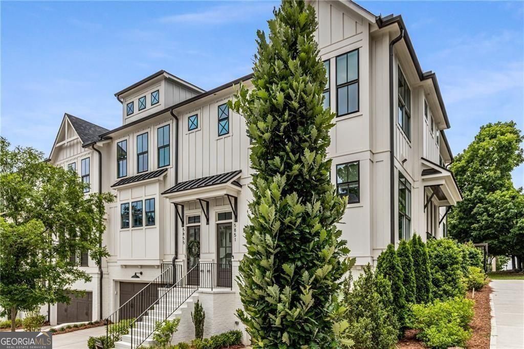 Modern Elegance in the Heart of Sandy Springs Welcome to this beautifully designed townhouse that perfectly balances style, comfort, and convenience. From the moment you arrive, the sleek exterior and landscaped setting make a striking first impression. Inside, an open layout connects the living, dining, and kitchen areas, ideal for everyday living or entertaining. Large windows fill the home with natural light, while the fireplace adds warmth and charm. The chef's kitchen features custom cabinetry, premium appliances, and a spacious island that doubles as a casual dining spot. The primary suite is a true retreat, with motorized blackout shades, a spa-like ensuite, and both a custom walk-in and an additional closet. Generously sized secondary bedrooms and well-appointed baths offer comfort for family or guests. Flexible spaces throughout provide options for a home office, media room, or guest suite. Step out onto the private deck, perfect for relaxing or hosting summer gatherings. Just moments from Whole Foods, fine dining, boutique shopping, and the Sandy Springs Performing Arts Center, this home offers an unmatched urban lifestyle. Schedule your private tour today and experience modern living at its best.