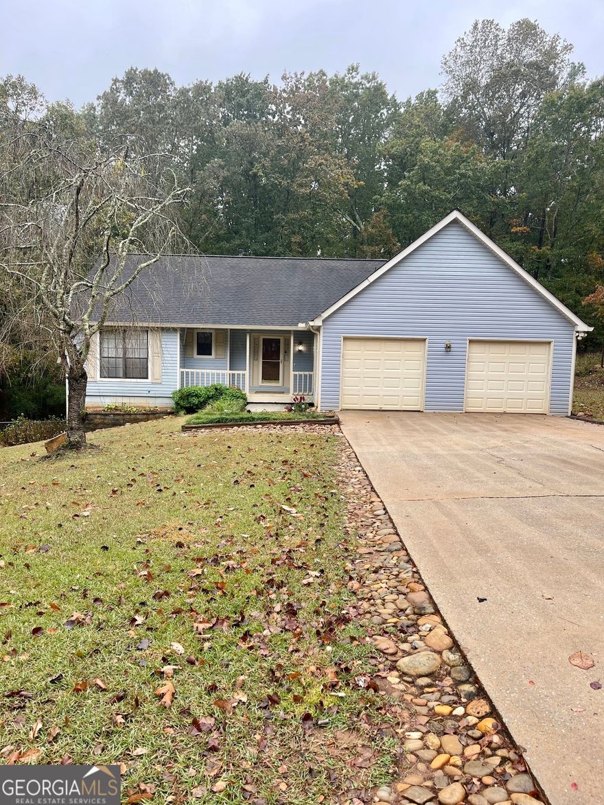 This well-maintained charming 3 bedroom / 2 bath ranch with basement is nestled on a desirable 1.11 acre lot that provides a private country setting with the convenience of nearby restaurants, shopping and access to I-20. The bamboo flooring and stone fireplace add the perfect touch to the spacious living room. Kitchen offers plenty of cabinet space, breakfast nook and separate dining area. There's even a built in area complete with sink, making the space ideal for a beverage or coffee bar. Secondary bedrooms share a full bathroom accessible from hall, complete with a combination tub/shower. Primary bedroom features walk-in closet and en suite bathroom which includes double vanity sink, custom made shower and separate bathtub. Walk-in laundry room can be found at the end of hallway. Step outside to an oversized back deck perfect for entertaining guests or unwinding after a long day - complete with a relaxing hot tub combined with private fenced in backyard. The basement offers endless possibilities- ideal for a workshop, extra storage, or finish it out to create the perfect man cave, home gym, or whatever your heart desires. Professional pics coming soon!