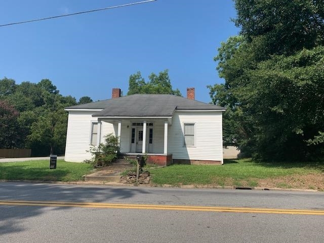 This is a turn of the century home in downtown Brooks, Ga. The lot is oversized at 093 acre. The house has been made ready for your final finishes as it is currently in the framing stage inside. A possibility for two bathrooms. A master suite addition at the rear of the house could be added. Possibilities are there. Also there is a detached garage on the property as well for storage. You must see this one. Survey of the property available! Photos Coming Soon!