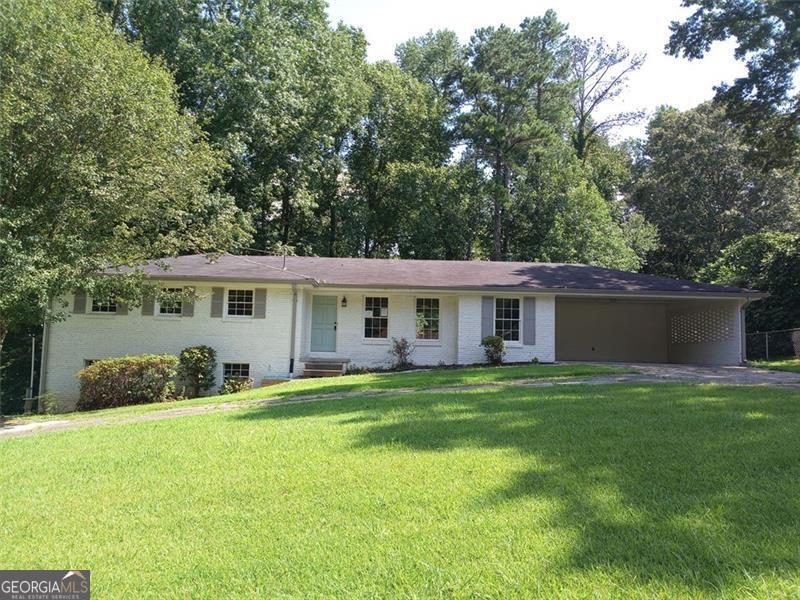 Updated brick ranch located in Shallowford Heights. Features include, Bright and open floor plan with great room and dining room, 3 bedrooms and 2 full baths on the main level plus a full finsihed lower level with a brick fireplace and 3rd full bath. Luxury Vinyl Plank flooring throughout, updated lighting and plumbing fixtures, granite countertops in the kitchen and bathrooms, stainless-steel appliances. Bright and open floor plan, Great curb appeal with a circle driveway, large front and back yard. So much house for the price. Do not miss this one!