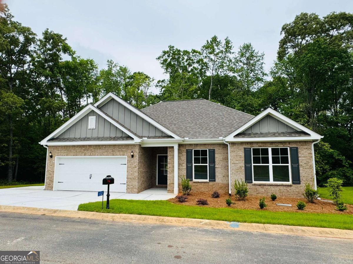 Our Glendale B3 Plan, Lot #9. New Construction!!! This charming brick-front ranch offers an unbeatable location just minutes from Lake Hartwell. With 3 spacious bedrooms and 2 full bathrooms, this home offers comfort and functionality for everyday living or weekend getaways. Enjoy cooking and entertaining in the beautifully appointed kitchen, featuring 42" cabinets, sleek stainless appliances, a large granite island, and plenty of workspace. The open-concept great room boasts soaring 10+ foot ceilings, creating a bright, airy feel thatCOs perfect for relaxing or hosting guests. The primary suite is a true retreat with a luxurious bath that includes a granite-topped vanity and an oversized tiled shower. Situated just 1 mile from downtown Hartwell and the nearest boat ramp, and only 2 miles to Hartwell MarinaCothis location is perfect for lake lovers and outdoor enthusiasts. Move-in ready with a quick 30-day close! DonCOt miss your chance to own brand-new near the lake!
