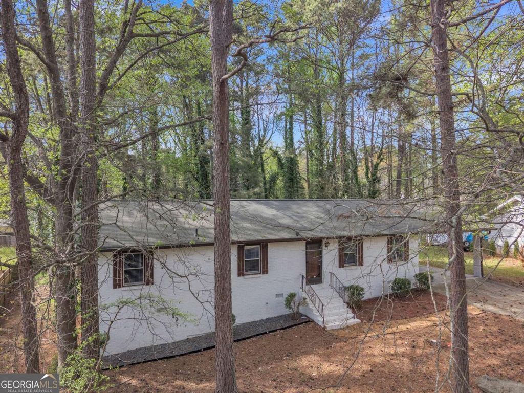 Photo of 5521 E Wind Drive SW, Lilburn, GA 30047 (MLS # 10722047)