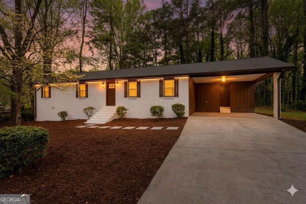 Photo of 5521 E Wind Drive SW, Lilburn, GA 30047 (MLS # 10722047)