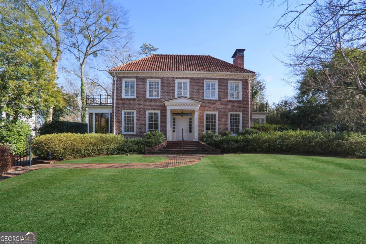 A truly exceptional residence in the heart of sought-after Druid Hills, where luxury meets comfort and elegance. This expansive property offers a rare opportunity to reside in one of the most desirable neighborhoods, overlooking the prestigious golf course, and boasting an enviable array of features. Meticulously designed and maintained, this home features spacious rooms for entertaining and two exquisite sunrooms flooded with natural light. The newly renovated kitchen is a chef's dream, complemented by a cozy breakfast room and mahogany family room. Upstairs, find spacious bedrooms including a generous primary suite. Outside, an arbor covered patio overlooks the pool and landscaped yard. A guest house above the garage offers versatility, with an artist studio or home gym. A two car garage and additional, gated off street parking ensure privacy and security. Don't miss this rare opportunity to own a historic gem in Druid Hills.