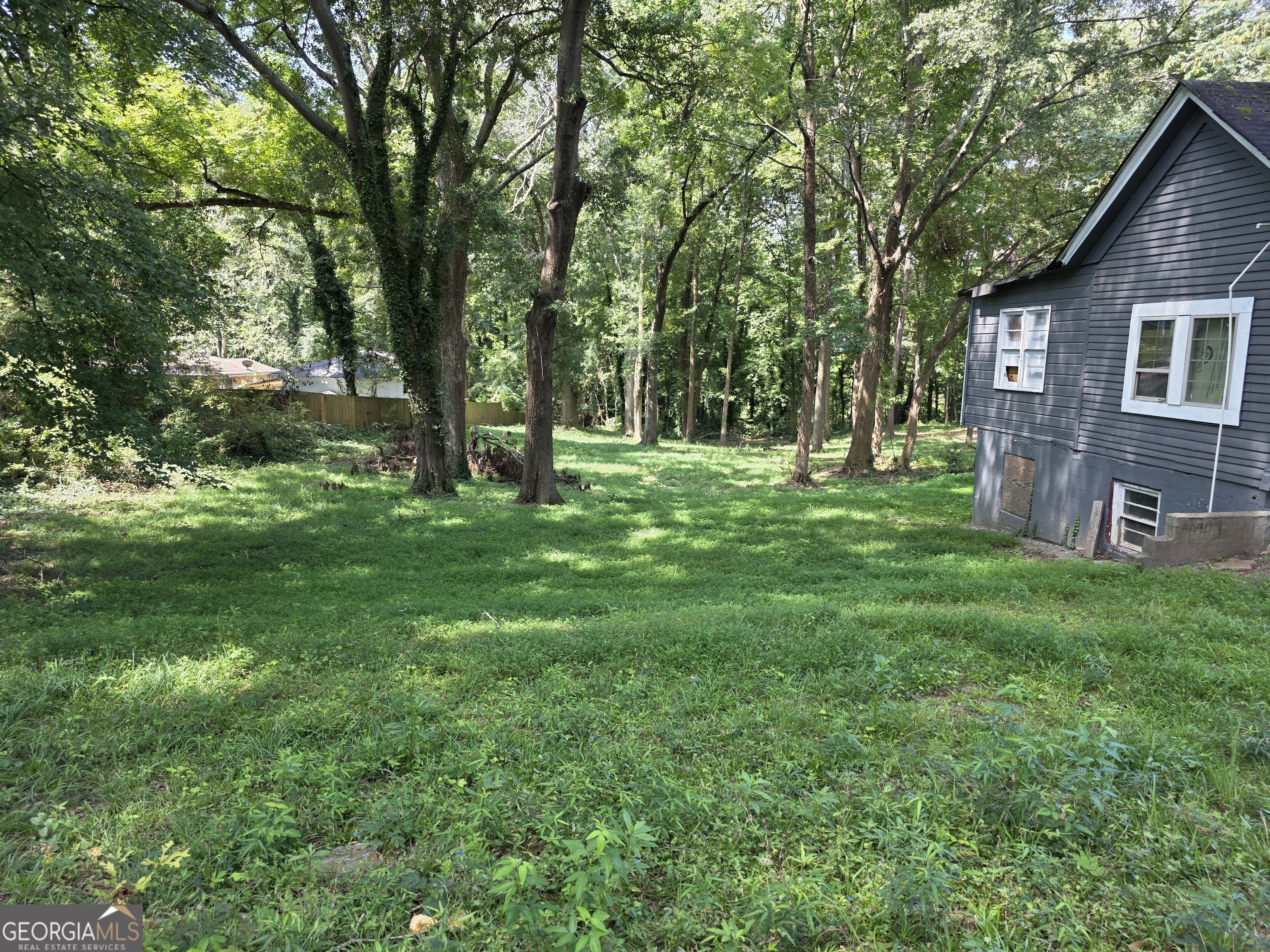 It is an investor's dream for the opportunity to own a prime piece of land to develop and build their dream project on. Whether you're building your dream home, townhomes, row homes or a rental property, 892 Ridge Avenue is the perfect canvas for your vision. This spacious, beautiful lot is zoned R5 which accommodates larger multi-family buildings like townhomes and row houses; the possibilities are endless. Don't miss this gem of a great opportunity in a growing neighborhood which includes several newly constructed homes, as well as homes currently under construction. There is currently a 1,256 sq. ft. home on the property which can be re-purposed or demolished. All utilities are readily available. The property is within quick access to Interstates 285 and 20 and conveniently located within close proximity to downtown, Atlanta; the Mercedes Benz Stadium; State Farm Arena; The Georgia Aquarium; Atlanta Hartsfield-Jackson International Airport; parks, colleges, Universities and so much more. Don't miss out on this hidden gem in a growing, neighborhood!