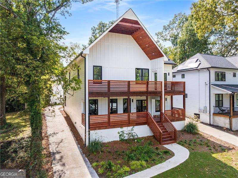 4 bedroom Main Residence + 1 Bedroom attached apartment + Detached 2 bedroom apartment! Experience the perfect blend of upscale living and smart investment in this stunning new construction home, ideally situated on a quiet dead-end street in Atlanta's highly desirable Upper Westside. Just minutes from The Works, Interlock, Westside Reservoir Park, and Mercedes-Benz Stadium, this location offers a rare combination of peaceful privacy and unbeatable city access. The main residence is thoughtfully designed for both everyday living and effortless entertaining. At the heart of the home is a chef's dream kitchen featuring stainless steel appliances, an expansive island, generous counter space, and a walk-in pantry-all seamlessly flowing into a spacious open-concept living and dining area. Enjoy outdoor living with a covered front patio deck, perfect for morning coffee or evening gatherings. Upstairs, the oversized primary suite is a true retreat with a custom walk-in closet, a spa-inspired ensuite with soaking tub, and a private covered balcony. Additional bedrooms are generously sized and complemented by beautifully tiled bathrooms. Expanding the home's versatility, an attached in-law suite offers a private 1-bedroom, 1-bath layout complete with a full kitchen and living area-ideal for guests, extended family, au pair, or short/long-term rental income. To further maximize potential, a detached carriage house at the rear of the property features a 2-bedroom, 2-bathroom unit with its own kitchen-an excellent opportunity for generating rental income or accommodating additional family members, home office, studio or more! Located within the sought-after Bolton Academy, Sutton Middle, and North Atlanta High school districts, this one-of-a-kind property is perfect for families, investors, or multi-generational living.