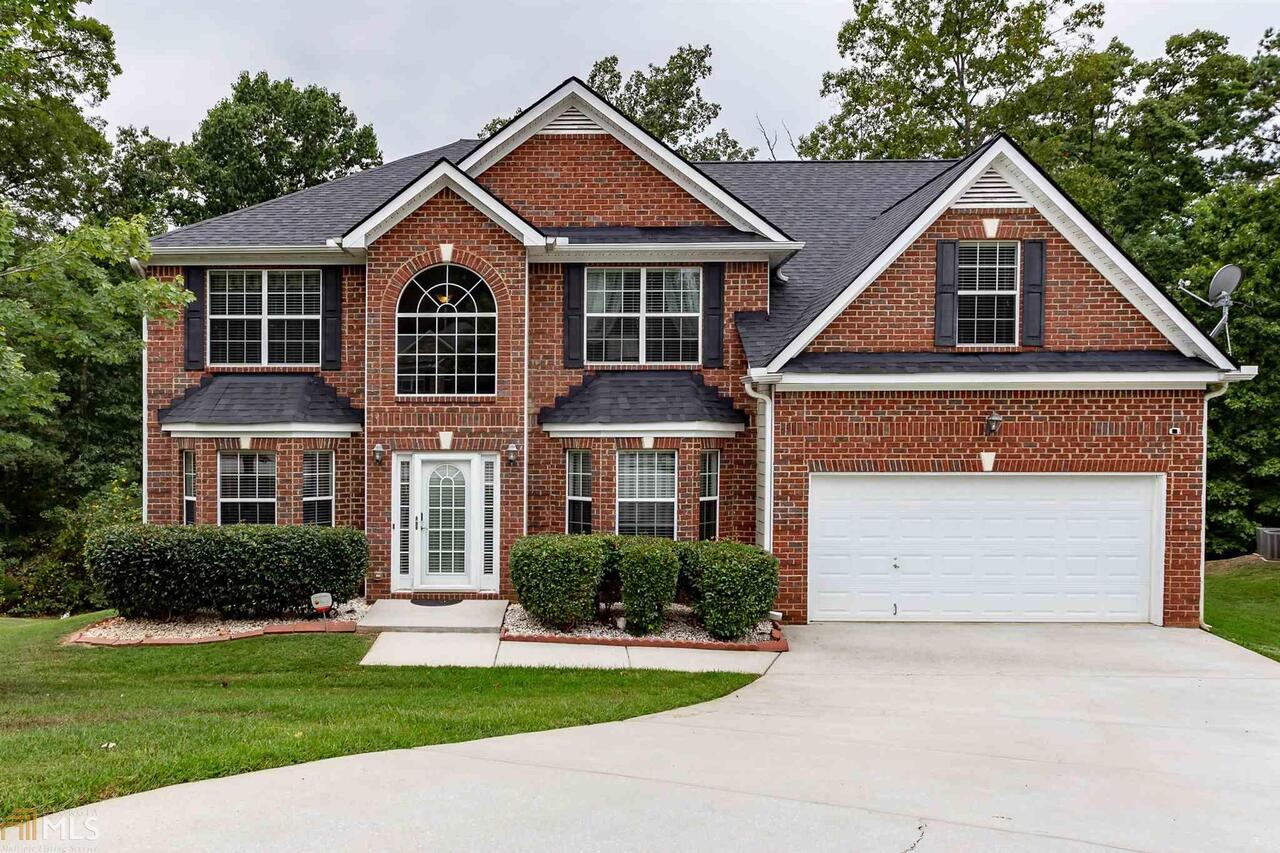 Welcome home to this two story home boasting 5 spacious bedroom & 3 full baths on a private lot/cul-de-sac. Enjoy family time in the open kitchen w/ granite counter tops & view to family room. Retreat to the HUGE master suite with dual vanity, walk-in closets, sitting room & high ceilings. Nice sized, spare bedrooms also have high/trey ceilings! Suite on main level is perfect for overnight guests. Convenient to shopping & entertainment, I-20, Airport and an easy commute to Atlanta!