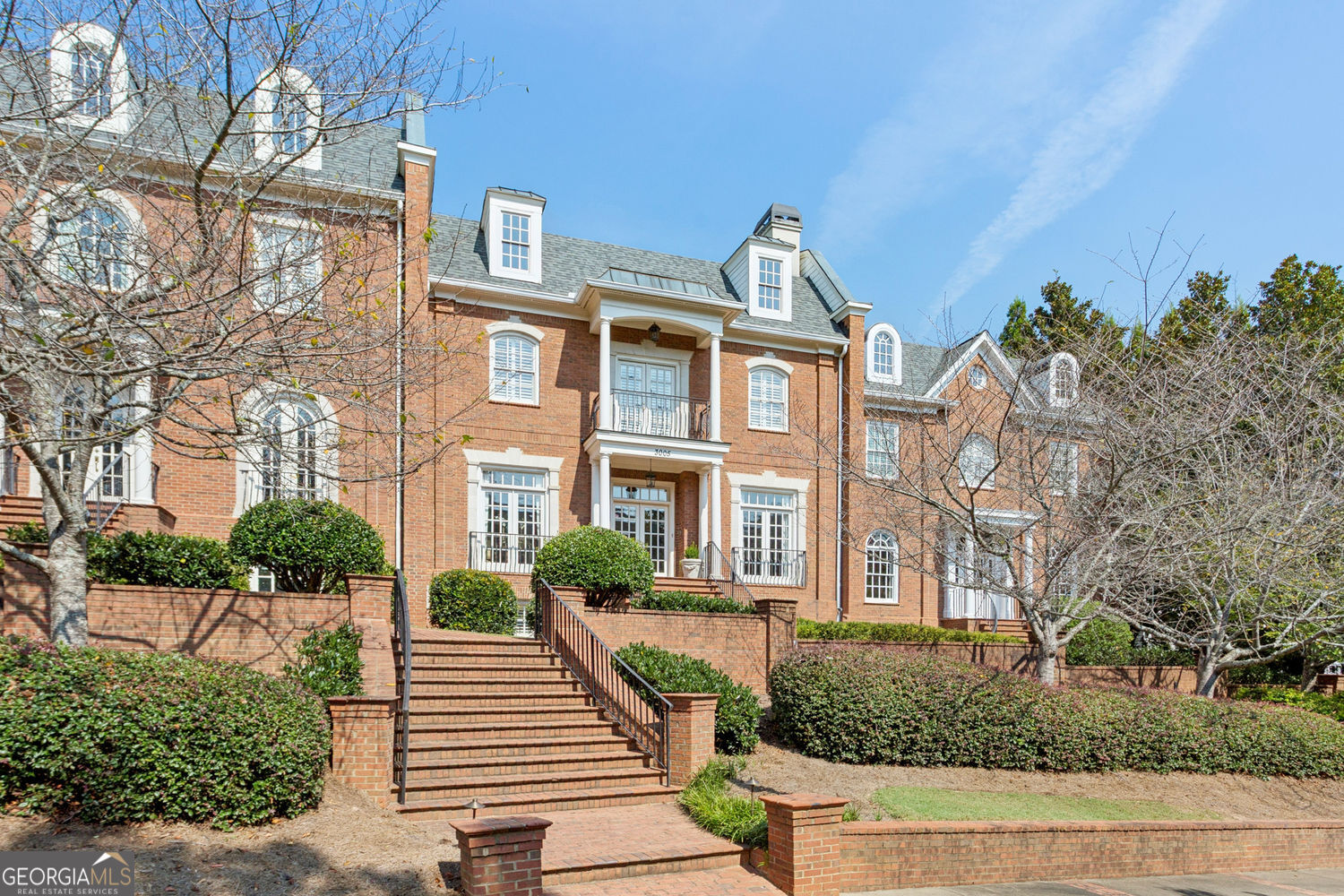 Here's your opportunity to own a fabulous townhome in a small 4 unit community in the heart of Vinings. This designer owned home offers stunning renovations and upgrades on every level. Walk into a wide entrance foyer that extends back to the family room with views through to the brick enclosed patio. Warm living room/study and formal dining room offing heavy moldings are the first beautiful inviting rooms that you see. Center of the foyer leads to staircase and three story elevator. There is a large wet bar and wonderful custom built-ins off the living room and a spacious butler's panty from the dining room to the kitchen. The oversized family room featuring old wooden beams , fireplace , and custom bookcases. Family room opens to top of the line gourmet kitchen offering custom designed cabinetry with cabinets up to the ten ft. ceiling height. A breeze way was enclosed to add a bright family dining room with a wall of glass and custom glass door overlooking the brick patio. Over the attached two car garage there is unfinished space for additional guest apt. with possible full bath. The second level has a large primary suite featuring a fireplace , oversized newer bath tub , seamless glass shower, and double vanities. It has a custom designed walk-in closet and a door that leads to the laundry room that also leads to second level landing. There are two additional bedrooms with ensuite full bathrooms. The lower level has painted scored concrete floors in a large rec or media room. There is another bedroom with a full bathroom. The other half of the lower level is unfinished with tons of storage and the perfect spot for a wine cellar. The home is full of special wallpapers, paint colors and designer' s beautiful touches throughout. Come see this spectacular property. You won't regret it!