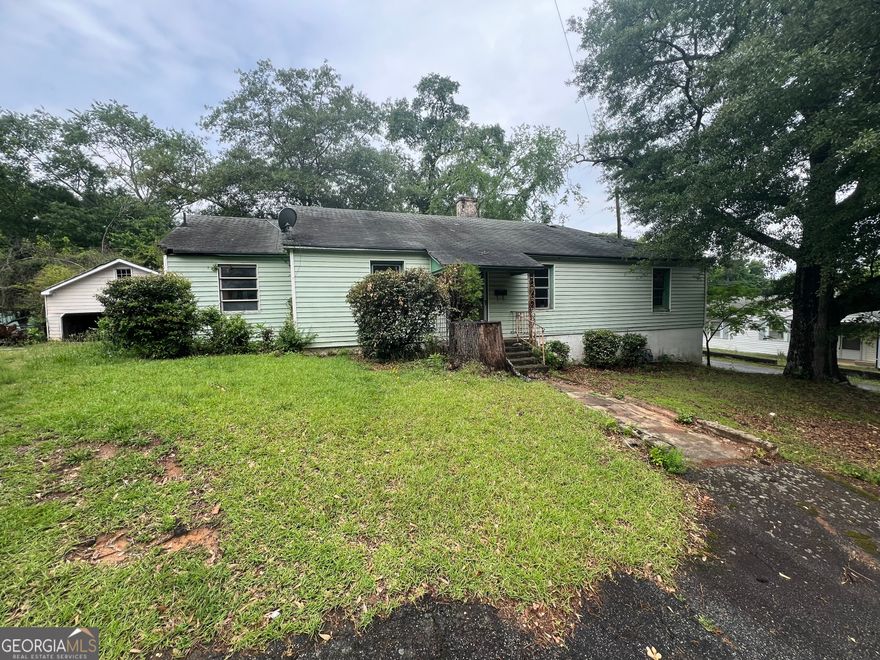Fixer upper in downtown Covington. Great potential with good size on a corner lot with a large garage/barn. Comps in the area are 400k+. Will need a total renovation top to bottom, inside and out. Cash only, investors only.
