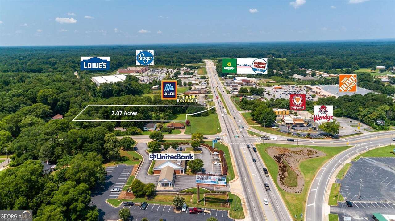 Excellent visibility on main retail corridor. 2.07 acres located in the City of Griffin zoned PCD. This parcel is adjacent to the new Aldi's on Hwy 16 (Taylor Street) and across from Popeye's, Wendy's, Lowe's, Home Depot, United Bank & More. This is a great site for a hotel, c-store, restaurant and many other commercial uses. All utilities are available to site. Property has limited frontage on Highway 16, adjacent owners are in agreement to participate in a joint venture. This is one of the last vacant parcels located along Highway 16 in this area. Traffic Count is 25,800 VPD. Lot slopes towards back of property in which there is over 200 feet of road frontage on Poplar Street.