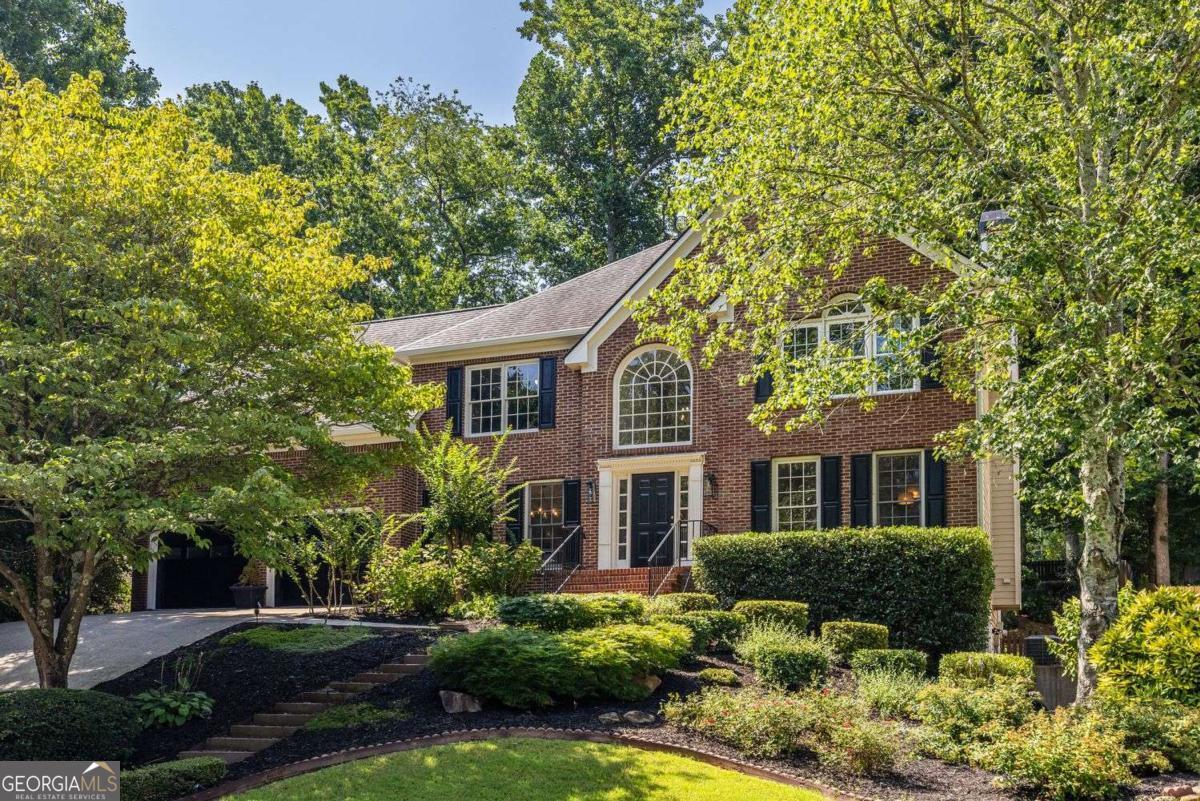 In coveted Chestnut Hill, this beautifully maintained home is priced just for you and offers comfort, space, and versatility-ideal for multi-generational living or working from home. Fresh paint, updated fixtures, and a chef's kitchen with pro-grade gas cooktop, new refrigerator, and direct garage-to-pantry access make life easy. Yes, the driveway climbs a bit-but it's easy to navigate and rewards you with direct access to the garage and a quick entry into the kitchen and spacious walk-in pantry. Unloading groceries couldn't be more convenient. The open main level features an eat-in kitchen, fireside living room, and vaulted screened porch. The primary suite boasts a fully renovated spa-style bath. A full terrace-level suite with private entrance, kitchen, bath, and laundry is perfect for guests, teens, or rental income. Chestnut Hill offers resort-style amenities including a swimming pool, tennis courts, pickleball, clubhouse, and playground. You'll love the easy access to Lake Allatoona, Downtown Acworth, Kennesaw, and just a straight shot to Atlanta-plus shopping, dining, and conveniences just minutes away.