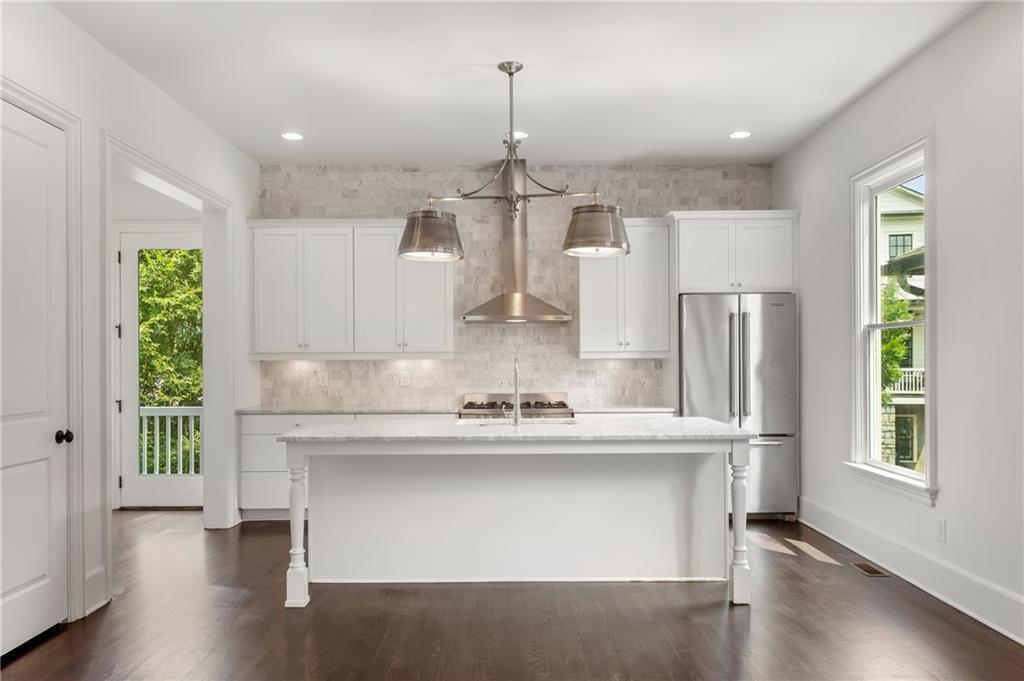 Introducing 918 Glenwood Park Dr., a stunning modern residence in Atlanta's Glenwood Park neighborhood. This home offers contemporary design, luxurious finishes, and thoughtful architecture, creating an exceptional urban retreat. Located near trendy shops, restaurants, and entertainment, this home embodies the vibrant Glenwood Park lifestyle. The open-concept floor plan, flooded with natural light, seamlessly connects the living, dining, and kitchen areas. The gourmet kitchen features high-end appliances, marble countertops, and ample storage. The primary suite includes a walk-in closet and spa-like ensuite bathroom. An elevator provides convenient mobility. The outdoor space is perfect for relaxation and entertaining. Additional bedrooms, bathrooms, and a two-car garage add flexibility and convenience. High-end finishes, including hardwood floors throughout and designer fixtures, adorn this modern residence. Smart home features control lighting, temperature, and security. Enjoy easy access to highways and transportation for a seamless commute. Don't miss the opportunity to own this exceptional home in Atlanta's Glenwood Park neighborhood. Experience contemporary urban living-contact us today.