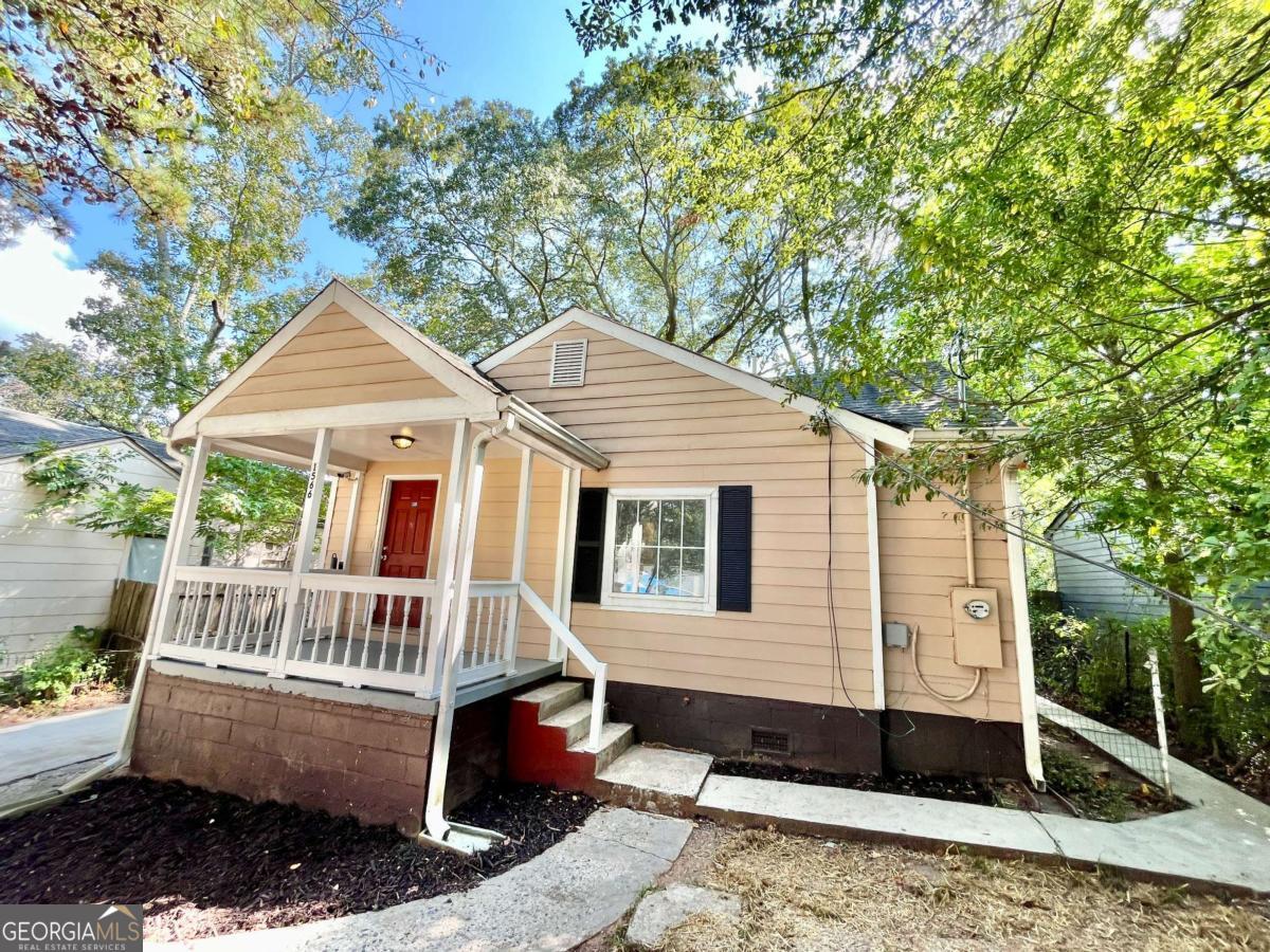 Relax on the front porch and wave to your neighbors! First-time buyers, don't miss this charming 1940s 3-bedroom, 1-bath home priced to sell. Inside you'll find original hardwood floors throughout, a spacious eat-in kitchen, a large laundry room, and durable Hardi-Plank siding. Located in the desirable Venetian Hills/West End community, you'll be close to Atlanta's best amenities, with new construction and renovations adding even more value to the neighborhood. The property sits on a large lot with a fenced backyard, perfect for outdoor living. Please note: Seller will not review blind offers or allow assignments. All buyers must physically view the property before submitting an offer. Broker/Agent/Owner. Alarm on premises-use caution.