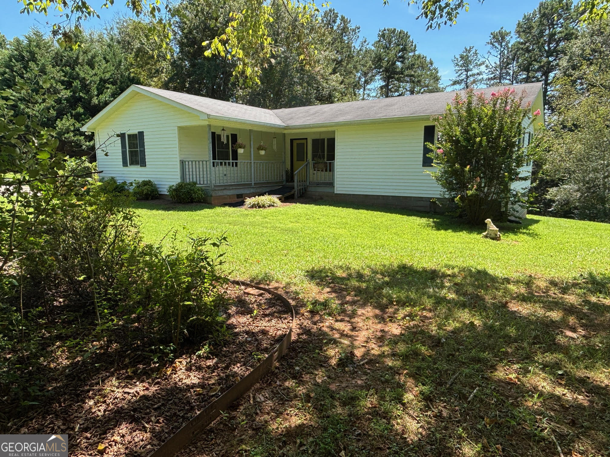 3br/2ba home situated on a private 1.1+/- acre lot with super easy access to Hwy 365! This wonderful home has so much to offer, and for those looking to not be in a subdivision, then look no further! Floorplan features an extra large master bedroom with 2 closets and well laid out master bath, kitchen with breakfast area, spacious living room, and secondary bedrooms at the opposite end of the home for added privacy. The covered front porch is the ideal spot to enjoy your morning coffee, or your relaxation spot after a long day. The beautiful lot is partially cleared and partially wooded for that perfect blend of usability and privacy. The paved driveway offers plenty of parking and there is a storage building that will be great for your tools and miscellaneous items. All kitchen appliances and washer/dryer included!