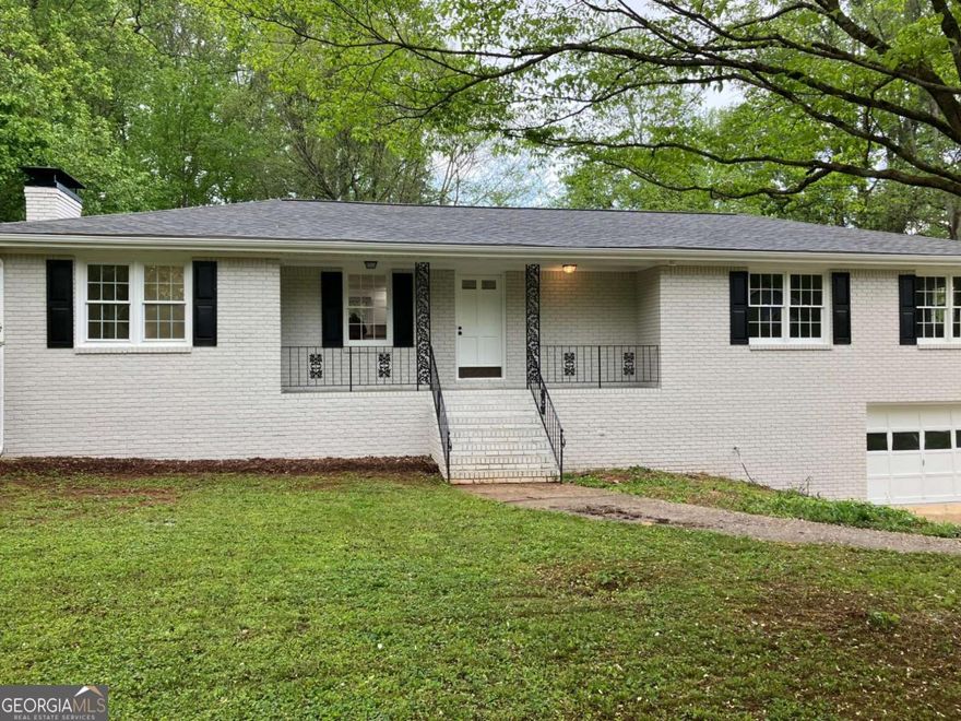 Charming 4-sided brick ranch in the coveted Sandy Plains Estate neighborhood! This bright, open concept home is equipped with updates throughout including new roof, new flooring, new plumbing, freshly painted inside and out, updated kitchen and bathrooms with an extra large master bath, and updated electrical and lighting. Recently updated with luxurious granite countertops that exude sophistication, the kitchen boasts a spacious island, perfect for both meal preparation and casual dining. Gleaming stainless steel appliances add a touch of contemporary style. Get comfy in the big family room with a cozy fireplace. The large screened-in porch overlooks a fenced, level backyard that can be your private sanctuary or place for entertaining friends and family. This home also has a full daylight basement, partially finished, for added space to customize and personalize as you choose. Located just minutes from I-75, I-575, Marietta Square, shopping, and fantastic local dining options, this home is also situated in the highly regarded Sprayberry High School district. No HOA! Don't miss this gem in the heart of East Cobb.
