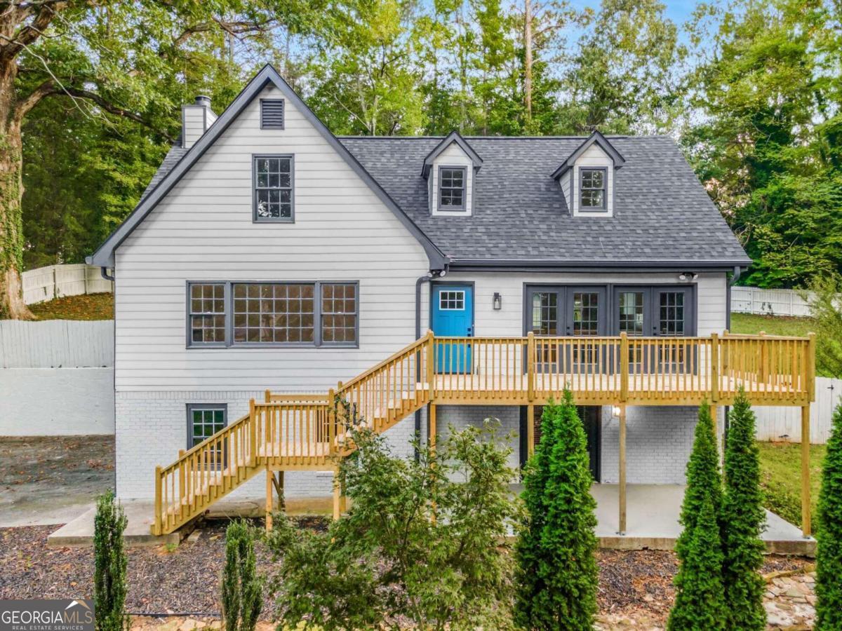 Welcome to this stunningly renovated 4-bedroom home in East Cobb! As you enter, you'll find the luxurious master suite conveniently located on the main floor, offering a private retreat for ultimate relaxation. The expansive family room is filled with natural light, creating a cozy and welcoming space for entertaining or enjoying peaceful nights in. The kitchen is a true showstopper, featuring elegant navy accents that exude timeless sophistication. A stylish feature wall adds a modern touch to the space, perfectly blending classic and contemporary design. Step outside to a large fenced-in backyard, perfect for outdoor activities, gardening, or simply soaking in the tranquility of nature. With .63 acres, thereCOs plenty of room to enjoy the peaceful surroundings. The finished basement, complete with a sleek wet bar, provides an ideal spot for entertaining guests or creating your personal getaway. This home effortlessly combines elegance and functionality, offering seamless indoor-outdoor living with spacious front and back porches. With a brand new roof, hot water heater, and upgraded electrical system, this East Cobb beauty is ready for you to move right in. DonCOt miss out on making it yours!