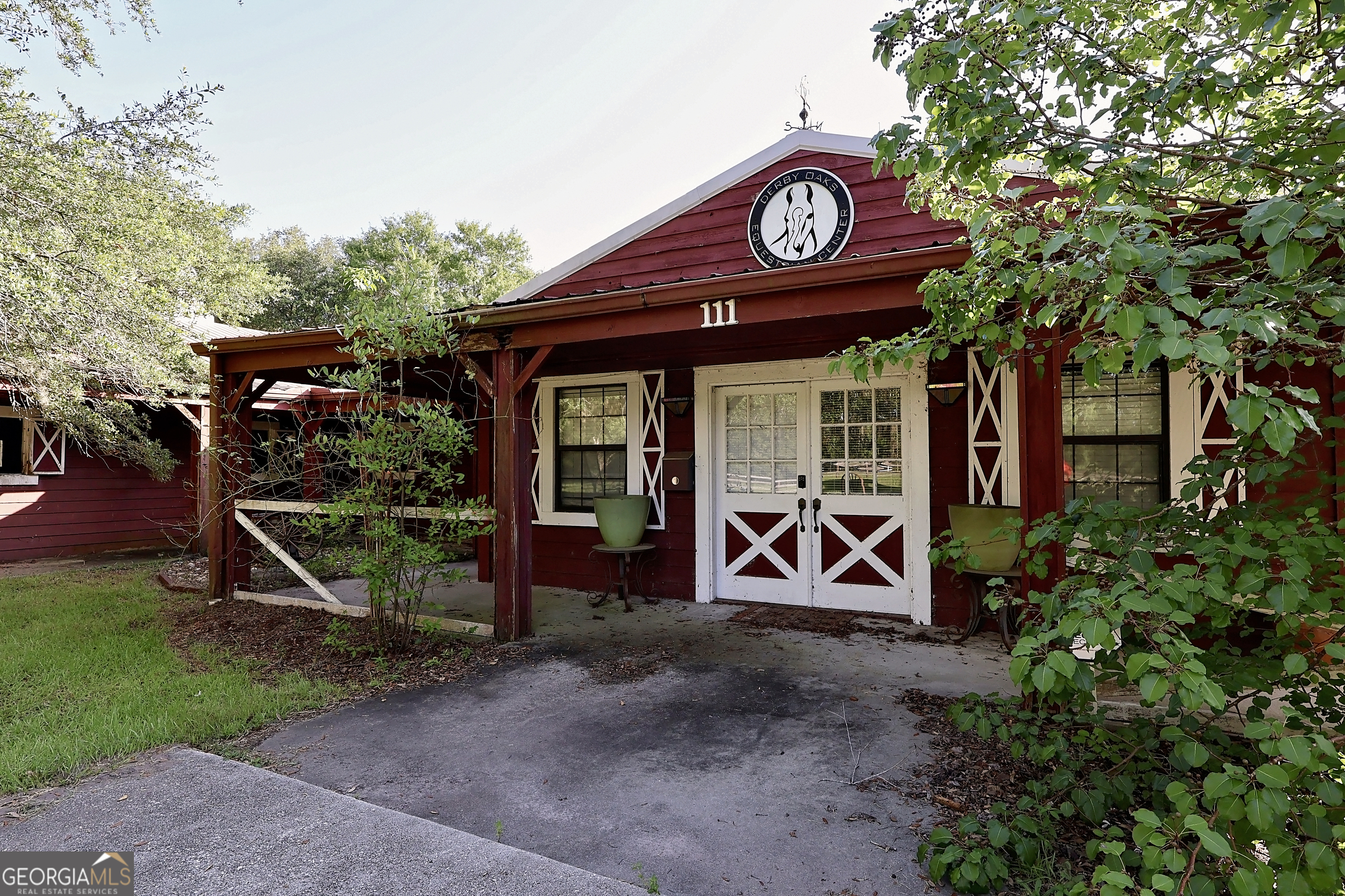 This well-established Equestrian Center offers a unique opportunity for horse enthusiasts, trainers, or investors. This facility offers quality boarding amenities with 24 stalls, feed room, wash stalls, heated and cooled tack room, laundry room, professional training areas with a round pen, riding arena and paddocks. The property is ready for a new owner to step in-whether you're looking to expand your equestrian business or take on a new venture in the growing horse industry. In addition to the main facility, the property includes a caretaker / trainer's apartment and /or office space with social center. For pastures there is an assignable lease for an additional 10 acres of non-buildable land at no cost for the life of ownership. While the property is ideal for continued equestrian use, several other permitted uses, offering flexibility for future diversification. This is a great opportunity to own a facility in a scenic, accessible and desired location!! This property is being SOLD AS-IS!