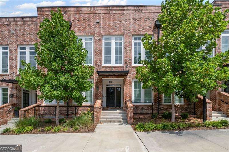 Prime Downtown Alpharetta Condo - Walk to Everything! Live in the heart of vibrant Downtown Alpharetta with this stunning 2-bedroom, 1-bath condo designed for modern living. Featuring 10' high ceilings, an open-concept floor plan, and walls of windows that flood the space with natural light, this home feels bright, airy, and welcoming. The spacious, updated kitchen offers plenty of room for cooking and entertaining, seamlessly connecting to the living and dining areas. Both bedrooms convenient to sleek, modern large bathroom and have walk in closets. Step outside your door and enjoy unparalleled walkability - just minutes to Fairway Social for games and fun, Ameris Bank Amphitheatre for concerts, the library, grocery stores, and countless restaurants and shops right in your neighborhood and downtown Cumming as well! Easy access to GA-400 makes commuting a breeze. This is your chance to experience the ultimate downtown Alpharetta lifestyle - where entertainment, dining, and convenience are all right at your doorstep!