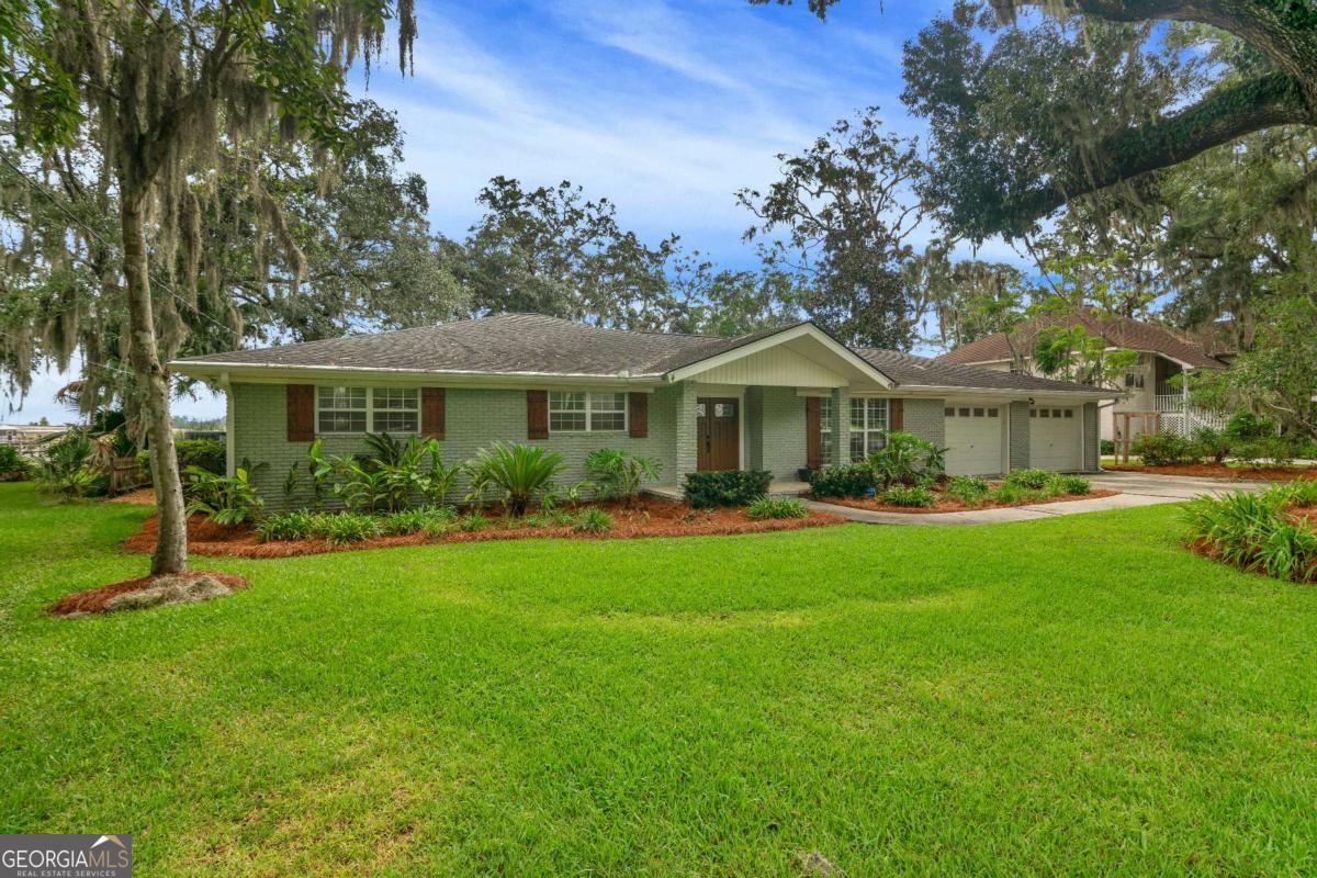 Are you looking for a coastal dream house on deep water with a private dock! You've found it at 179 Zellwood Dr! This beautiful waterfront home features a private dock on Fancy Bluff Creek with a boat hoist and dedicated jet ski pad. You can pull your boat right up to your own personal dock. Offering 3 bedrooms, 2 bathrooms, a home office and an open floor plan-this home has many comforts. The kitchen has been tastefully remodeled and offers a large island, granite countertops, tile backsplash. It opens into the living room that is anchored by a gas log fireplace. Outdoors, you will find a screened in pool, deck for grilling, greenhouse and a storage shed. The yard is adorned with beautiful oak trees, it truly is a coastal dream!