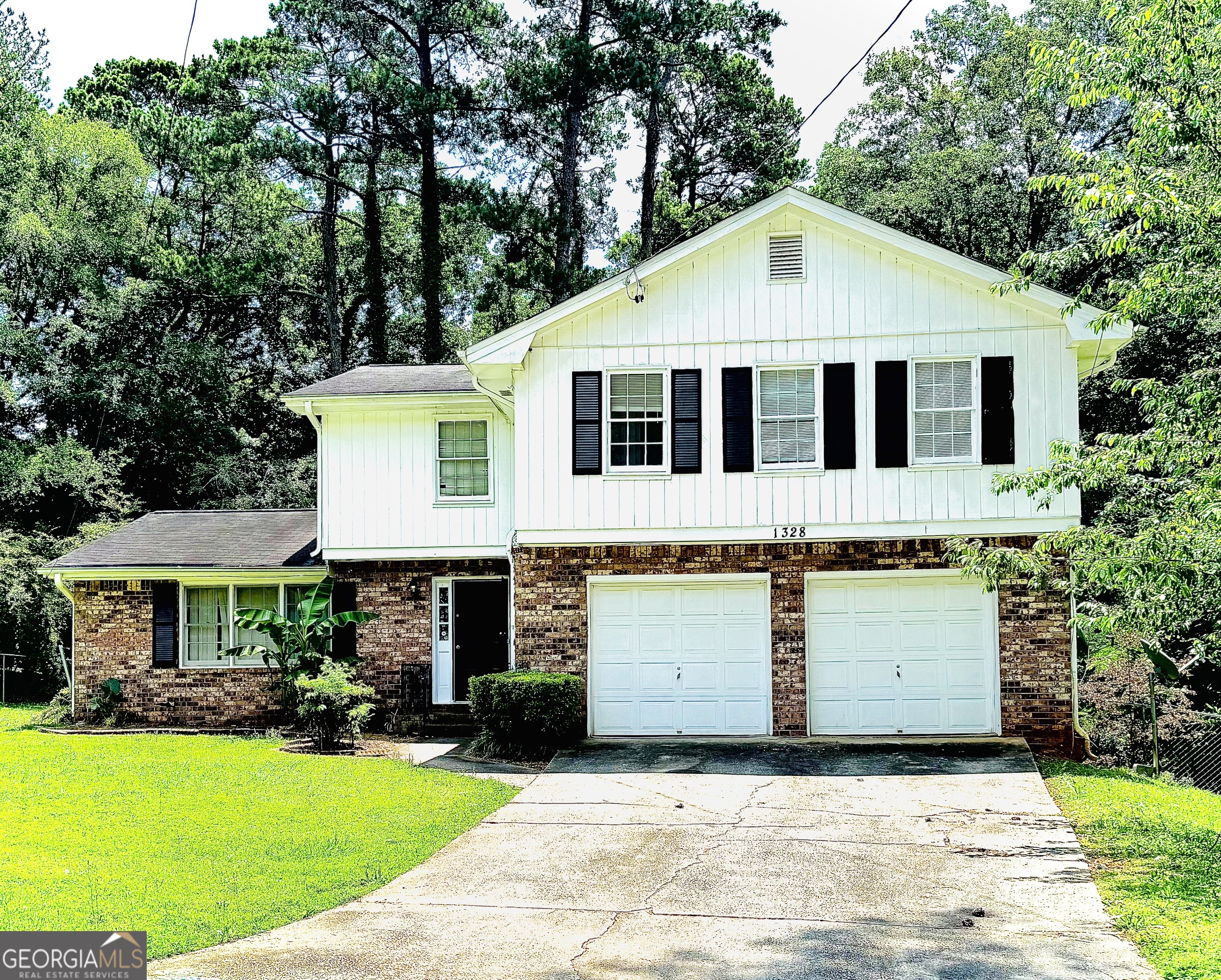 A spacious 4-bedroom, 2.5-bath home with a versatile bonus room, ready to be customized to your needs- work, play, or both! Tucked away in a picturesque cul-de-sac in Decatur, this home offers plenty of room to grow, work, and unwind. Inside, you'll find a bright living area, an eat-in kitchen, and a comfortable primary suite with an en-suite bath. Out back, enjoy a private deck that's perfect for grilling, entertaining, or just relaxing. Conveniently located near I-285, shops, schools, and more - this home is full of potential and ready for your personal touch.