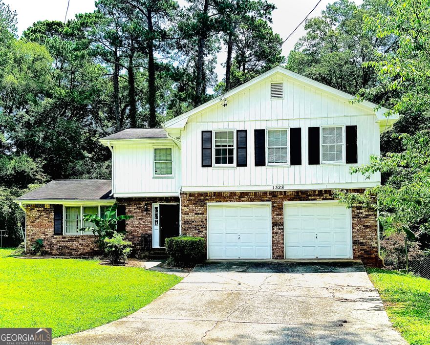 A spacious 4-bedroom, 2.5-bath home with a versatile bonus room, ready to be customized to your needs- work, play, or both! Tucked away in a picturesque cul-de-sac in Decatur, this home offers plenty of room to grow, work, and unwind. Inside, you'll find a bright living area, an eat-in kitchen, and a comfortable primary suite with an en-suite bath.  Out back, enjoy a private deck that's perfect for grilling, entertaining, or just relaxing. Conveniently located near I-285, shops, schools, and more - this home is full of potential and ready for your personal touch.