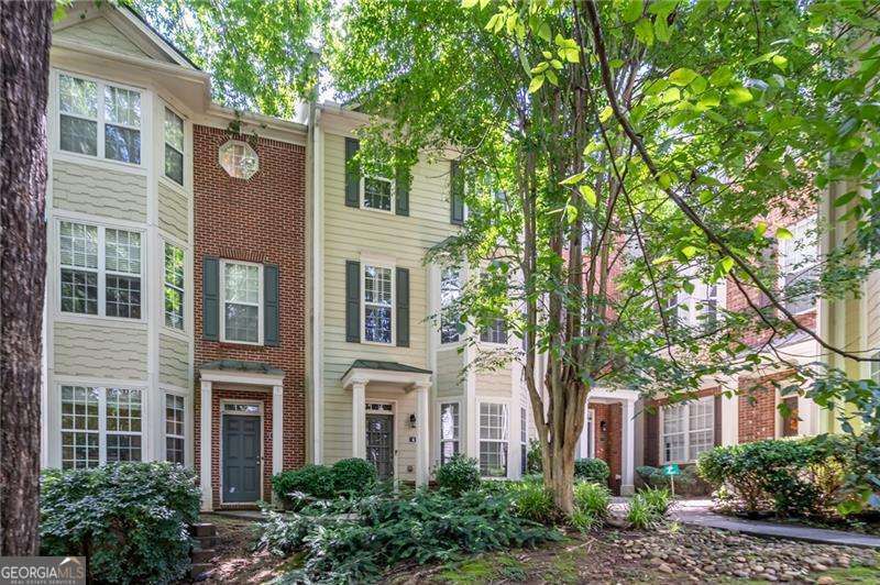 Move-in ready, spacious and freshly painted 3-bedroom, 3.5-bath townhome offering flexible living and plenty of natural light throughout. Featuring beautiful hardwood floors and crown moldings. The entry-level offers a versatile flex space-perfect as an office, guest suite, or media room-with its own full bath. Upstairs, the main level boasts a large living room with fireplace, a separate dining room with charming bay windows, and a well-equipped kitchen with stainless steel appliances, Corian countertops, walk-in pantry, and ample cabinet space. A convenient half bath completes the main floor. The upper level features a spacious primary suite with en-suite bath, double vanity, and large walk-in closet. A secondary bedroom with its own full bath and a laundry room complete with washer and dry are also located upstairs for added convenience. Enjoy relaxing or entertaining on the oversized deck. The home also includes a garage and generous storage throughout. Situated in a small, well-maintained community with low HOA fees. Unbeatable location close to everything Decatur has to offer with easy access to Emory, the CDC, and downtown Atlanta. You are just around the corner from Starbucks, Whole Foods, Sprouts, and LA Fitness. Decatur's Glenlake Park is also only a couple of blocks away with its huge pool, Tennis Center with multiple courts, playground, basketball court, and dog park.